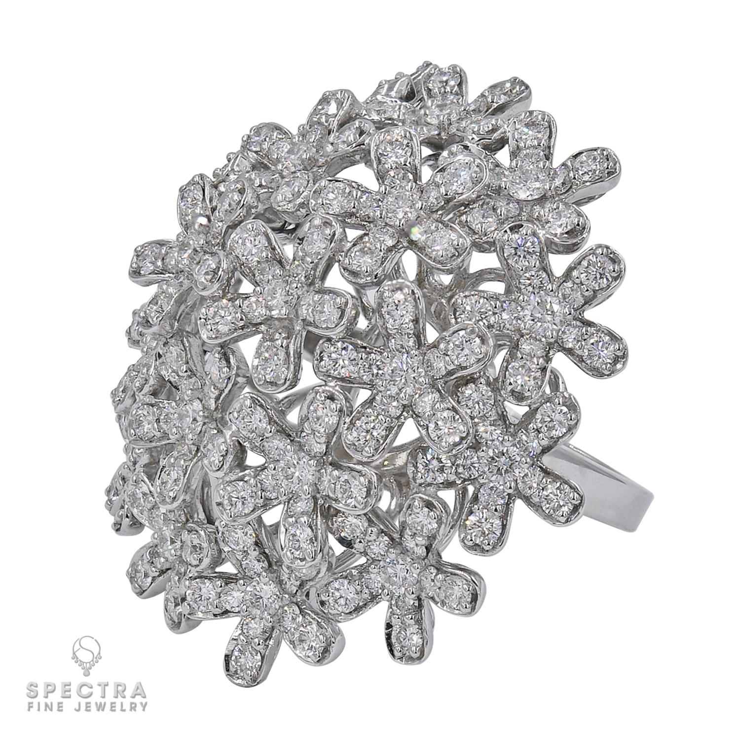This dazzling Van Cleef & Arpels ring from the impressive Socrate collection features a delicate sparkling floral bouquet crafted in 18k white gold and set with 132 brilliant-cut round diamonds of an estimated 2.64 carats. 
Made in France circa