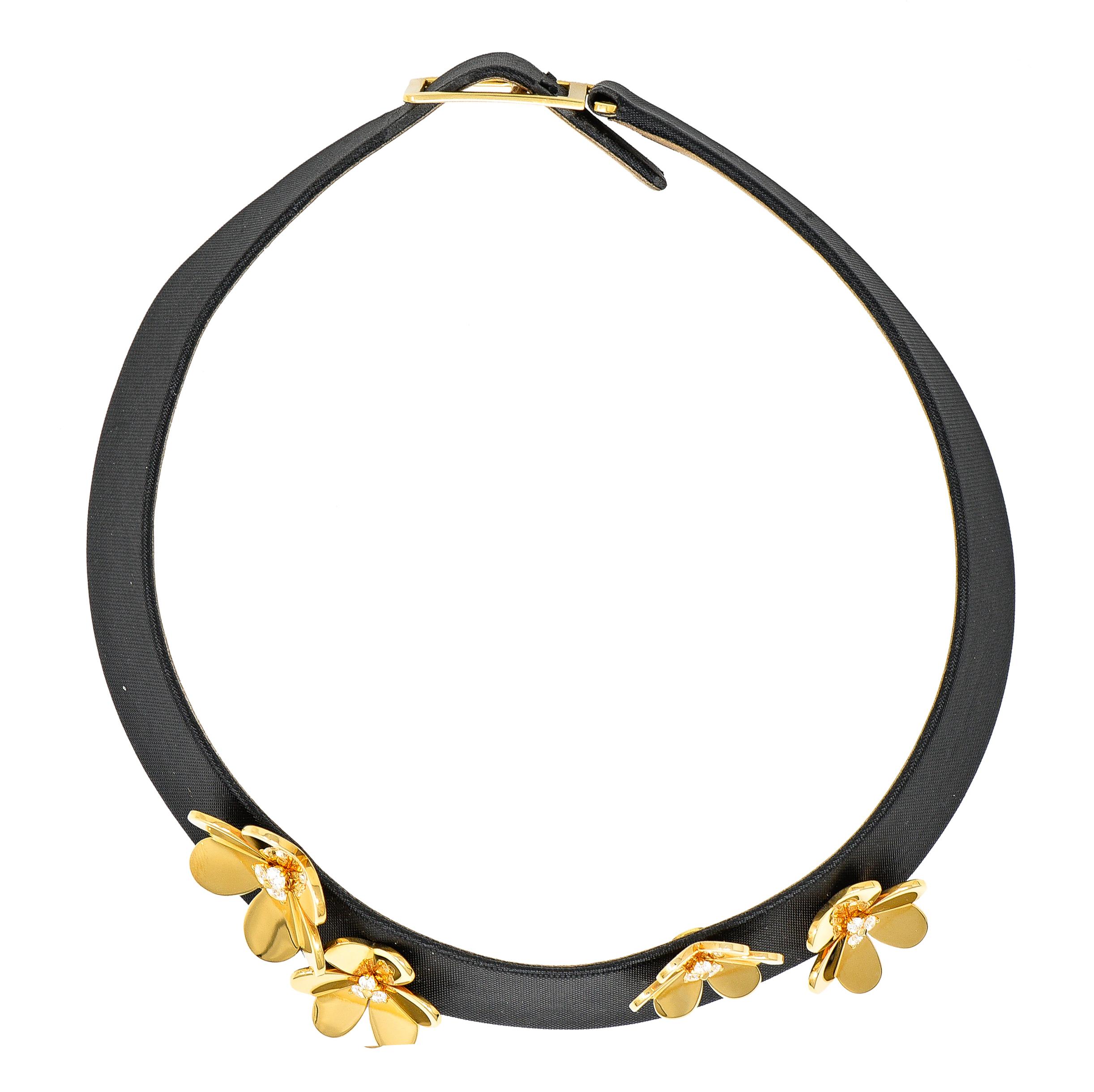 Designed as a wide black silk collar with four-dimensional gold three leaf clovers. High polished and centering clusters of prong set round brilliant cut diamonds. Weighing approximately 0.80 carat total - G/H color with VS clarity. Flowers can be