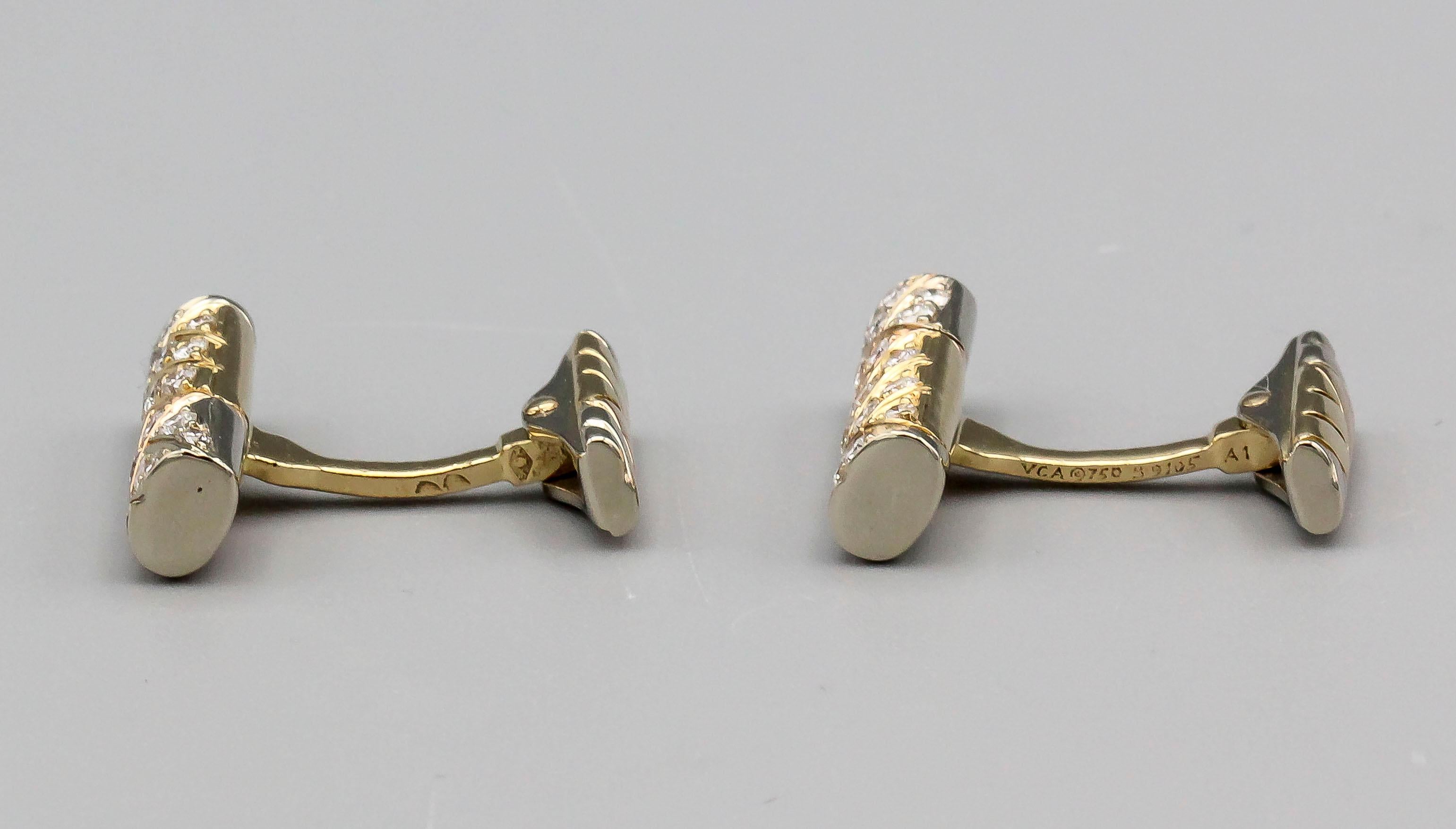 Fine pair of diamond and 18K 2-tone gold bar cufflinks by Van Cleef & Arpels, circa 1980s. They feature high grade round brilliant cut diamonds of 1.10 carats total weight, as marked on the cufflinks, moreover, the cufflinks are made in 18k white