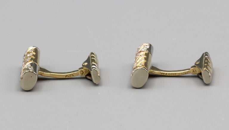 Fine pair of diamond and 18K 2-tone gold bar cufflinks by Van Cleef & Arpels, circa 1980s. They feature high grade round brilliant cut diamonds of 1.10 carats total weight, as marked on the cufflinks, moreover, the cufflinks are made in 18k white