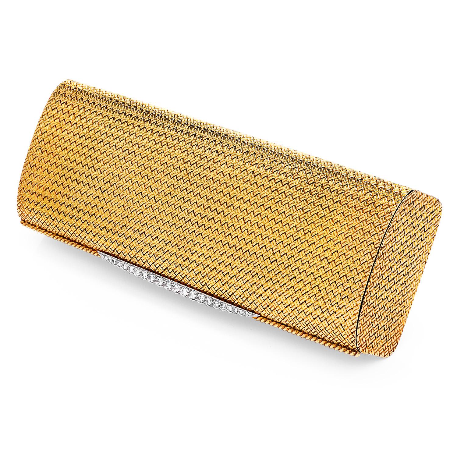 This exquisite Vintage Van Cleef & Arpels Clutch Purse from the 1960s has a woven style and it is crafted in solid with 18K Yellow Gold.

Topped with (22) round cut, pave set, genuine diamonds, weighing approximately 1.50 carats ( E-F color and