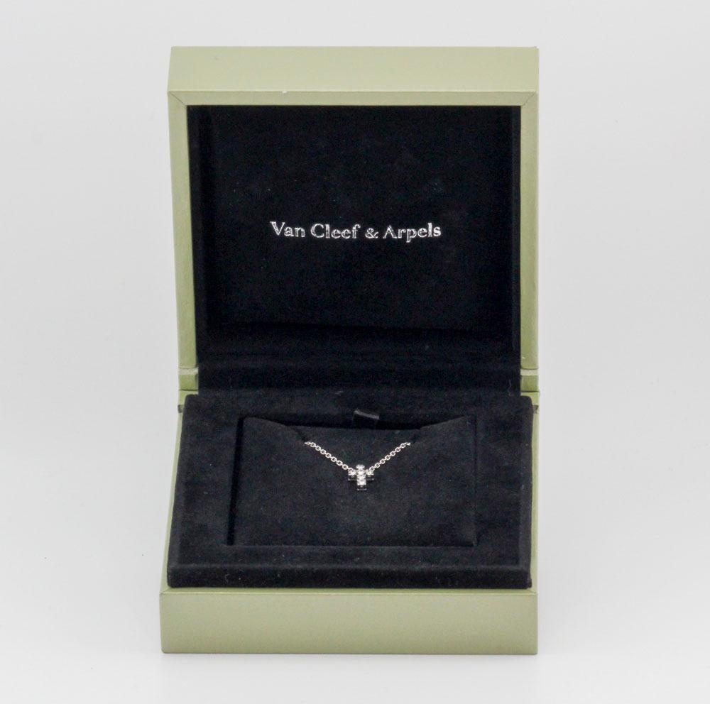 The Van Cleef & Arpels Diamond 18K White Gold Small Cross Pendant Necklace is a delicate and elegant piece of jewelry that combines timeless design with exquisite craftsmanship. This necklace is a true symbol of understated luxury and faith.

The