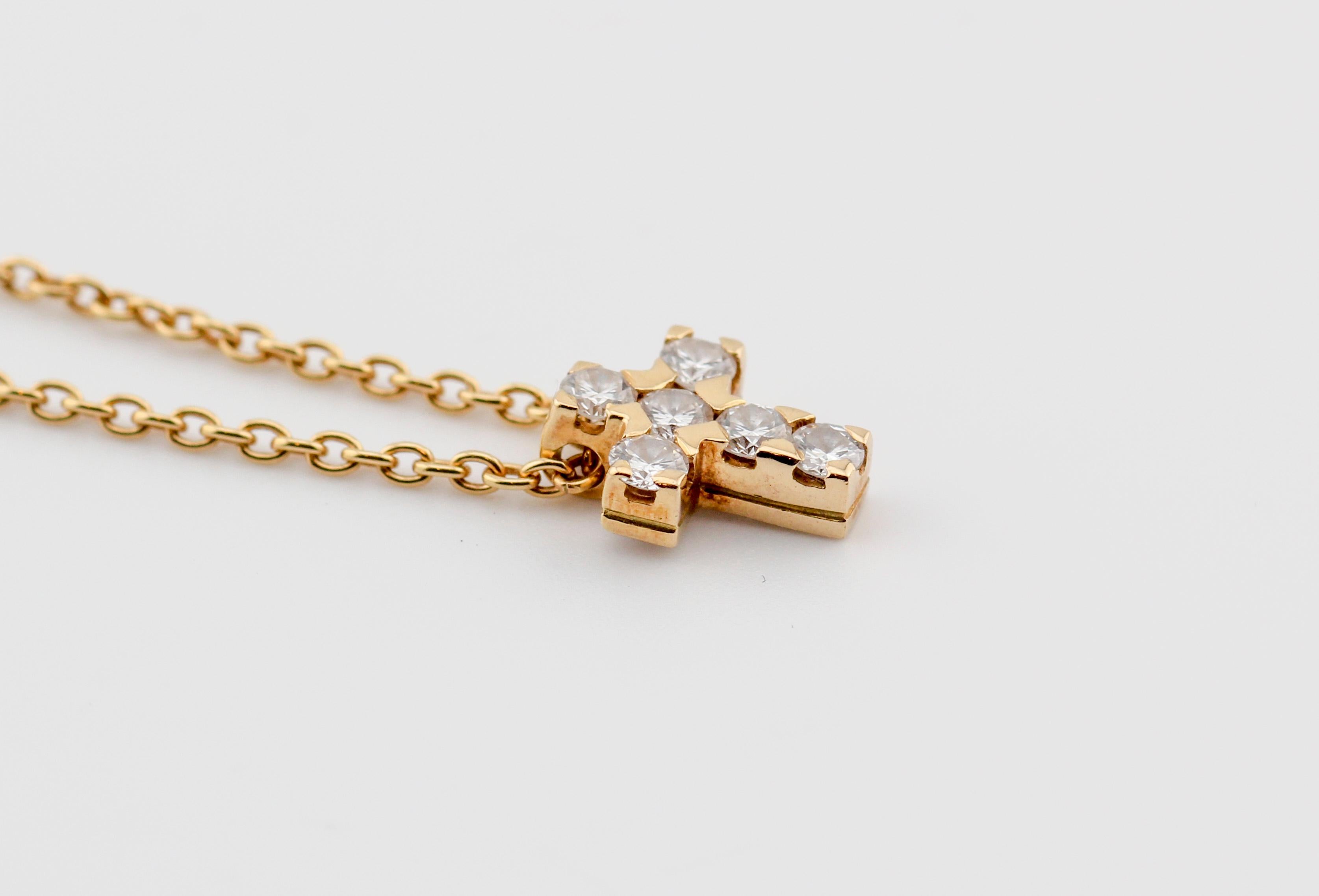 Elevate your style with the exquisite Van Cleef & Arpels Diamond 18K Yellow Gold Cross Pendant Necklace, a harmonious blend of elegance and spirituality. Crafted with the utmost precision and the finest materials, this necklace is a testament to the