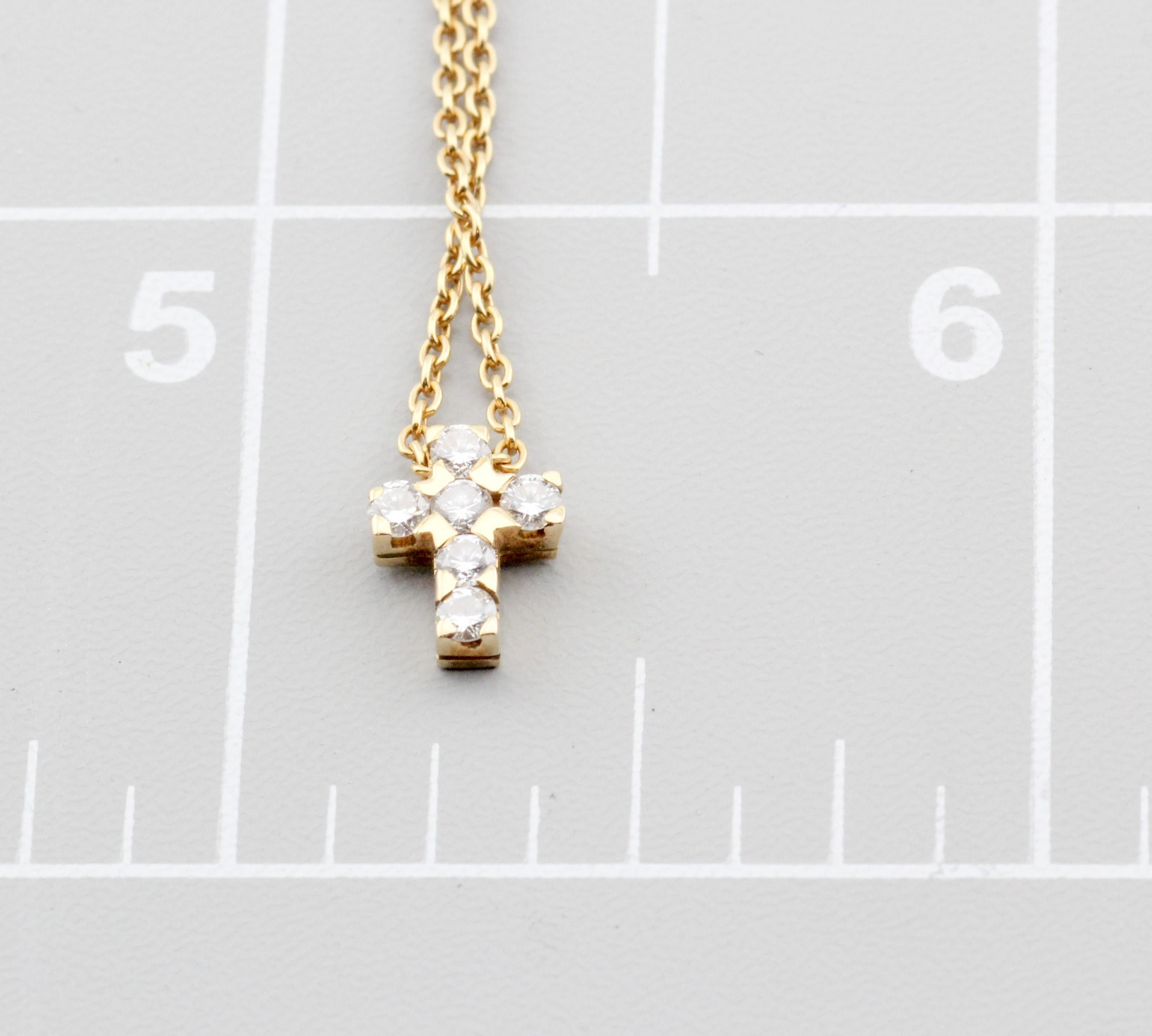 Elevate your style with the exquisite Van Cleef & Arpels Diamond 18K Yellow Gold Cross Pendant Necklace, a harmonious blend of elegance and spirituality. Crafted with the utmost precision and the finest materials, this necklace is a testament to the