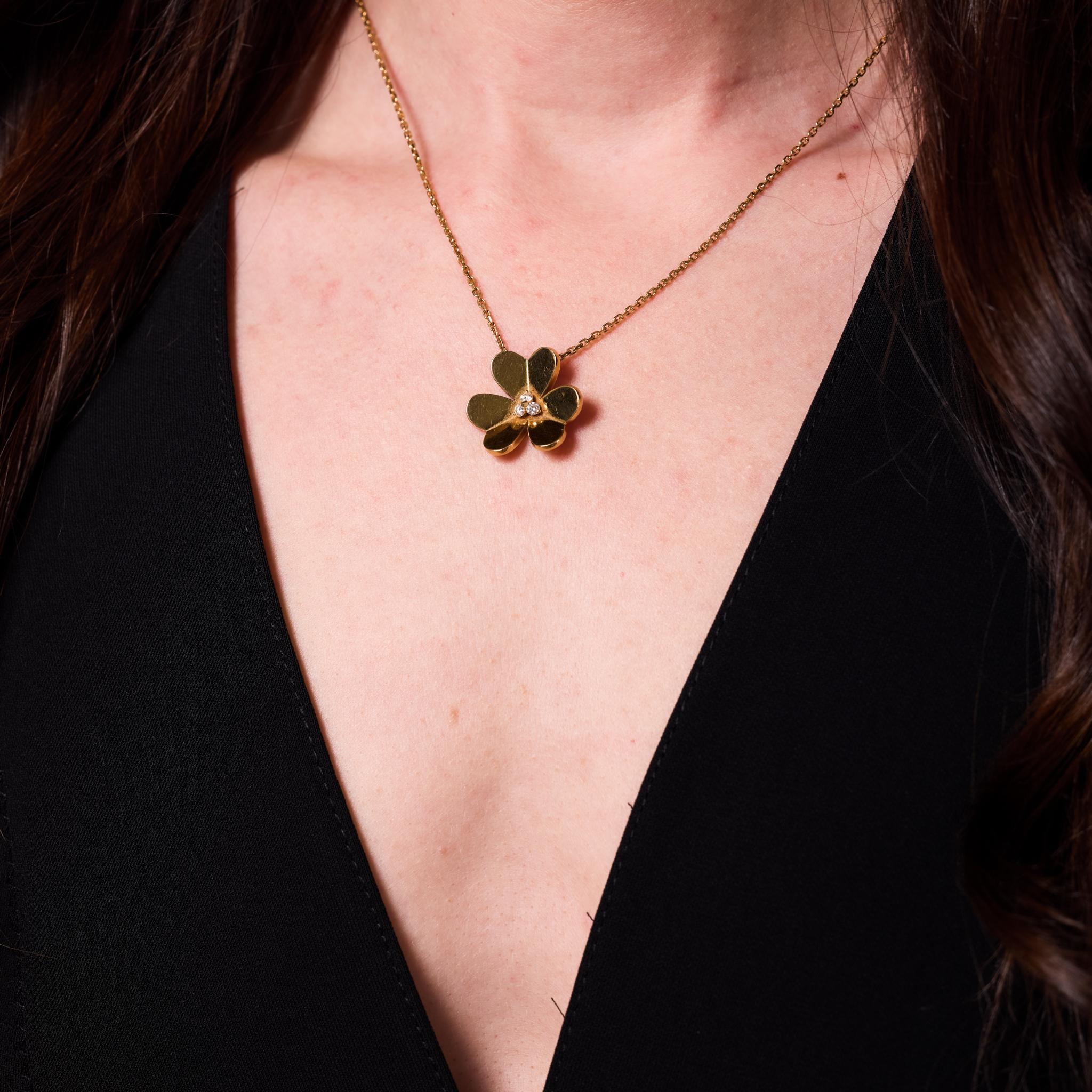 From the esteemed house of Van Cleef & Arpels, this modern necklace is a refined expression of French elegance. It features three round brilliant cut diamonds totaling approximately .15 carats, graded F color and VS clarity, delicately set in