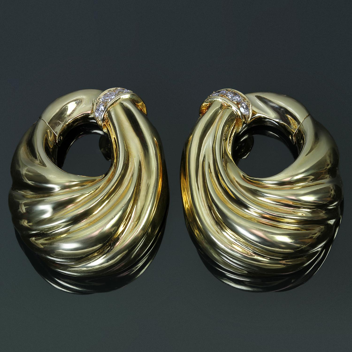 These fabulous vintage Van Cleef & Arpels earrings feature a swirling hoop clip-on design crafted in 18k yellow gold and set with brilliant-cut round D-E-F VVS1-VVS2 diamonds weighing an estimated 0.40 carats. Made in France circa 1970s.