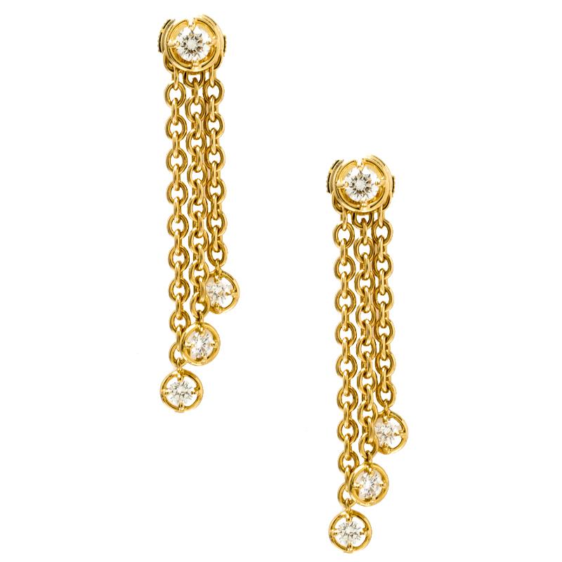 It is nothing less than a dream to own a pair of earrings as mesmerizing as this one from Van Cleef & Arpels. Finely created from 18k yellow gold, they have tassels with diamond drops falling from a single diamond, evoking a visual that takes one's