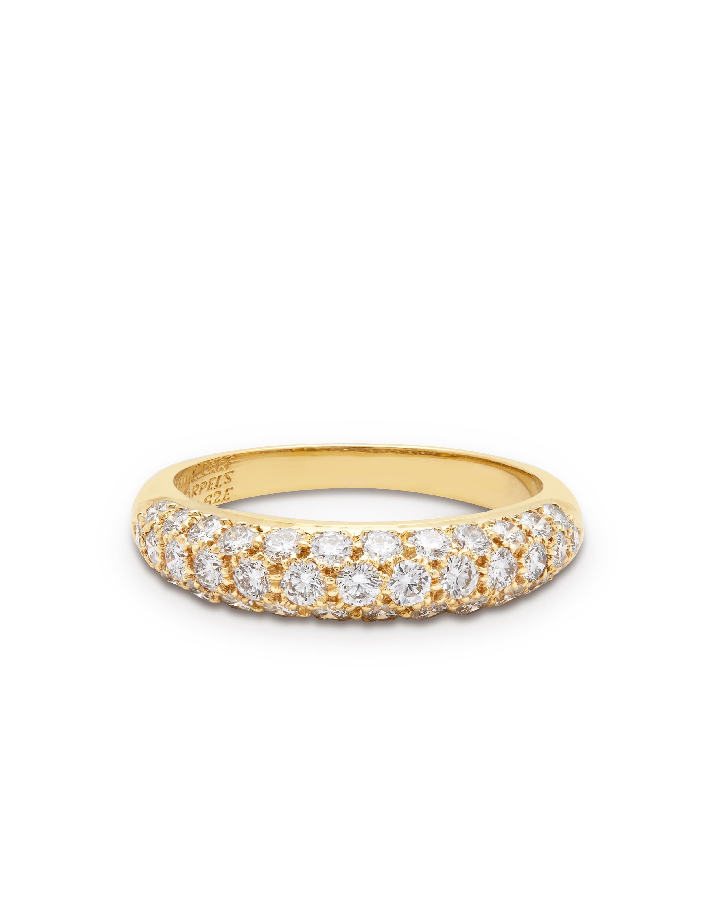 VAN CLEEF & ARPELS, A DIAMOND BOMBE RING

18ct yellow gold, pave set with round brilliant cut diamonds, half set Bombe with 3 rows of round-brilliant cut diamonds.
37 Diamonds individually weighing 0.05ct each, with a total approx diamond weight of