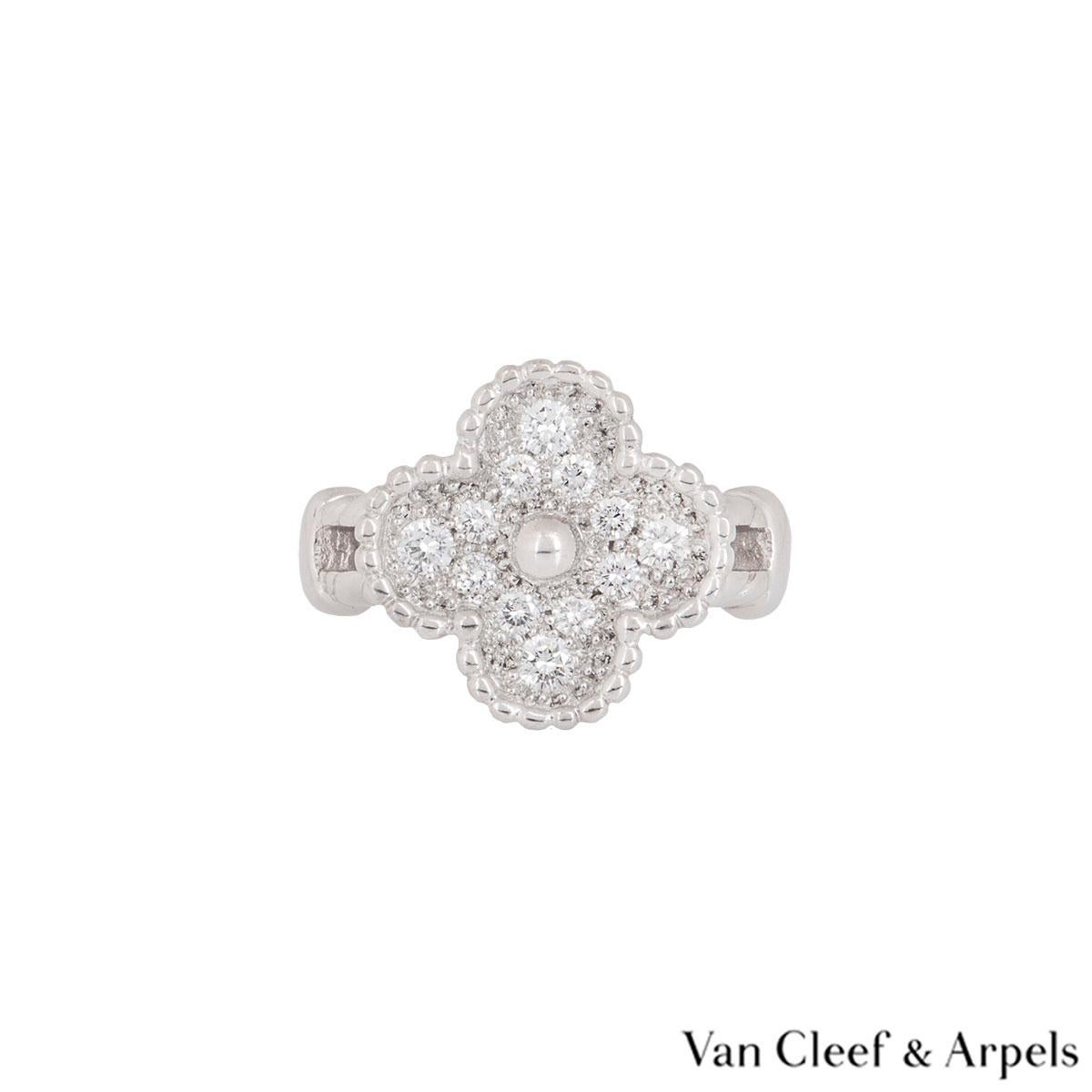 A beautiful 18k white gold Van Cleef & Arpels diamond ring from the Alhambra collection. The ring is composed of a four leaf clover motif set with 12 round brilliant cut diamonds alternating in size weighing approximately 0.44ct. The ring is
