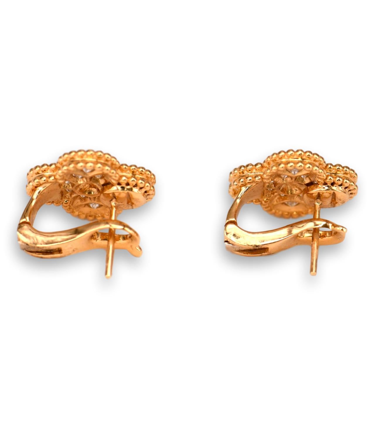 An iconic pair of 18ct yellow gold and diamond Vintage Alhambra ear clips from the House of Van Cleef & Arpels. Two rich yellow gold quatrefoil clover shapes have been expertly set with 1.02ct of sparkling colourless (DEF) brilliants and defined by