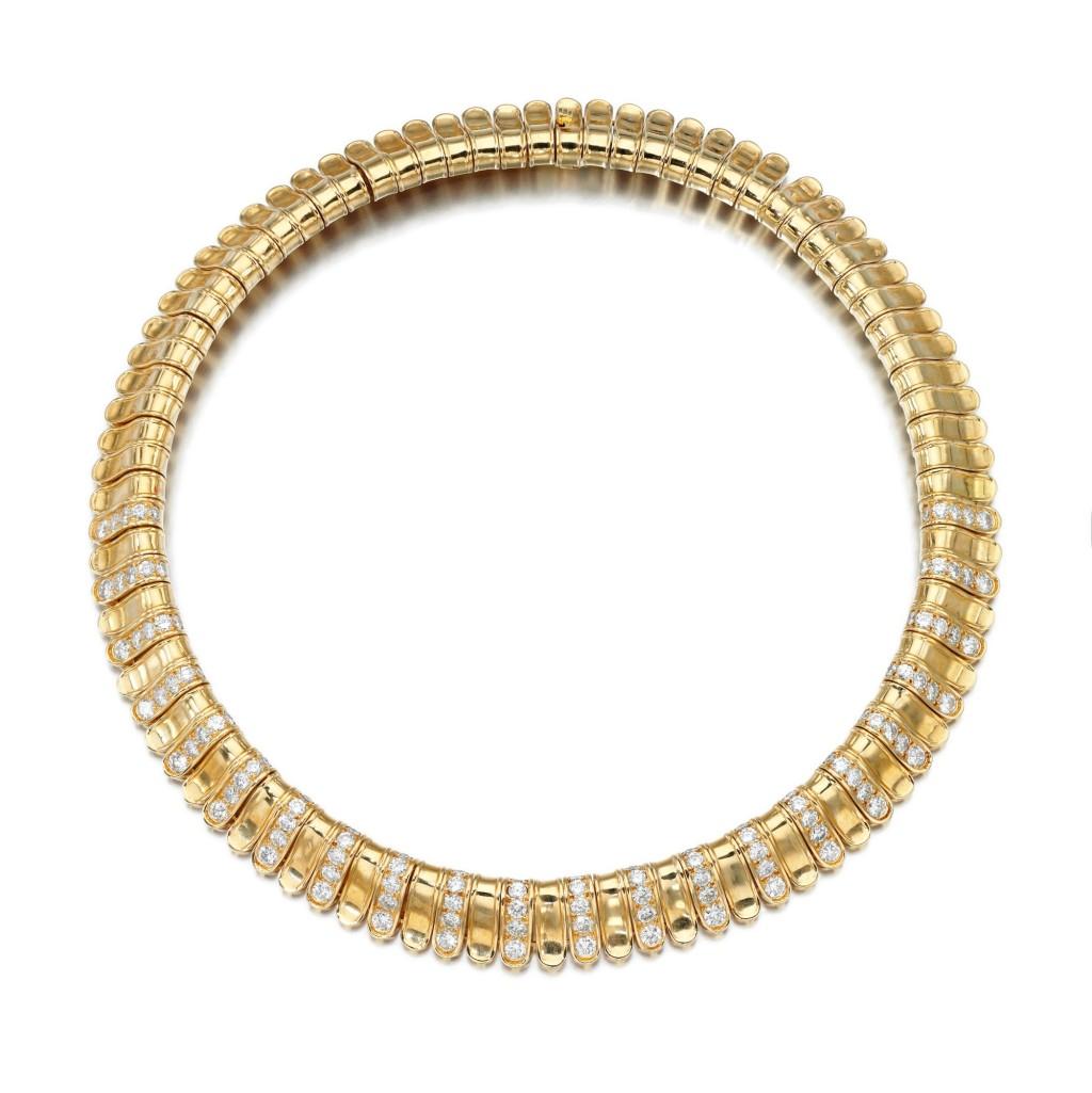 Designed as an articulated collar composed of lappet motifs, this VC and A piece is set to the front with brilliant-cut diamonds, inner circumference approximately 350mm, signed VCA, numbered, French assay and maker's marks.

SKU#N-01723