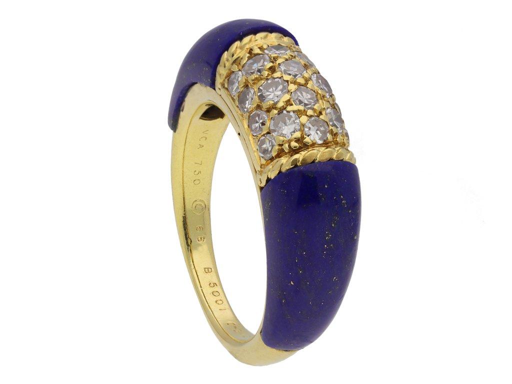 Vintage Van Cleef & Arpels diamond and lapis lazuli 'Philippine' ring. Set with eighteen round old cut diamonds to a central curving bezel in grain settings with an approximate combined weight of 0.60 carats within twisted rope effect borders,