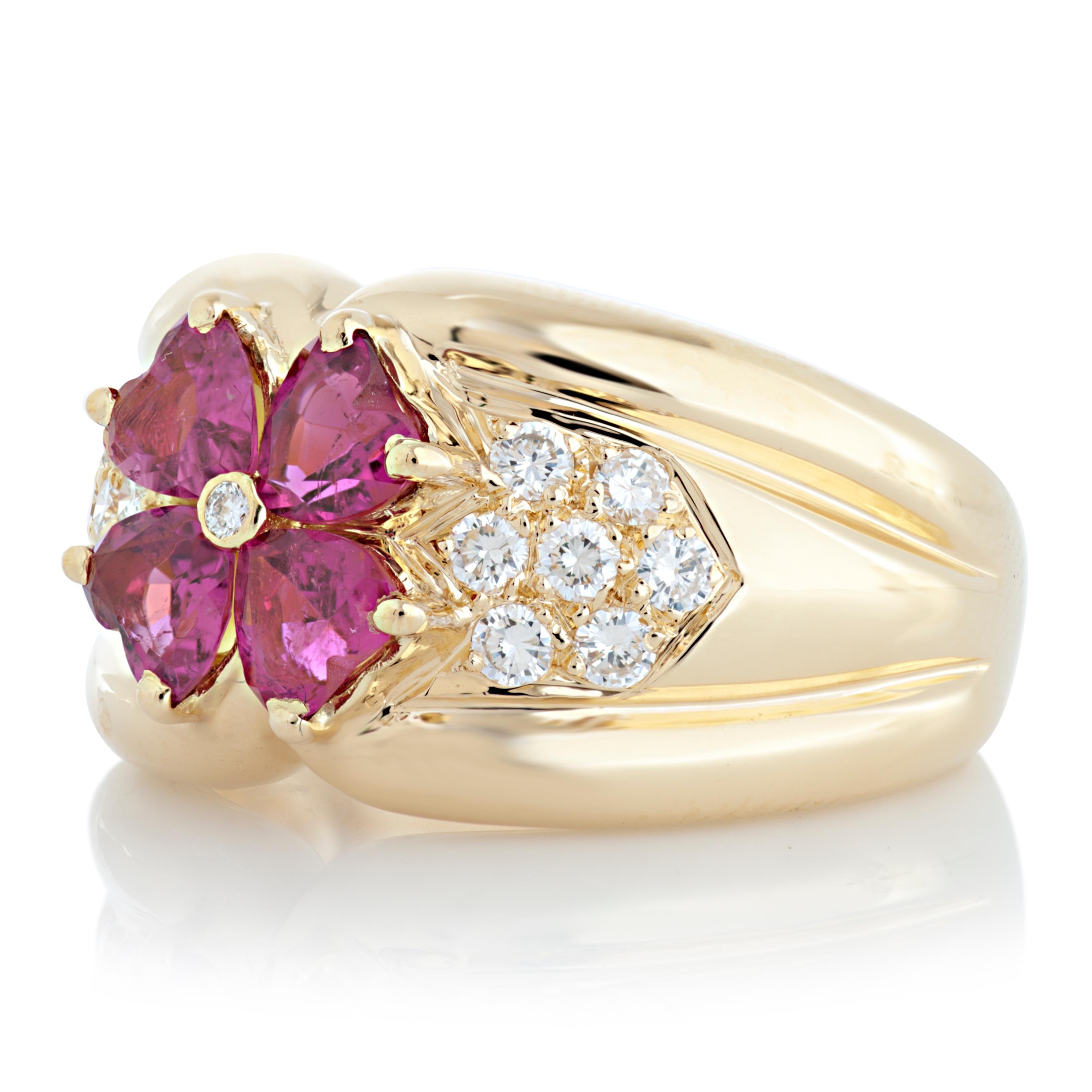 Van Cleef & Arpels diamond and pink tourmaline ring in 18k yellow gold.

This VCA ring features 4 heart shaped pink tourmalines set in a flower design totaling approximately 1.06 carat, as well as 0.35 carat of round brilliant cut diamonds with E-F