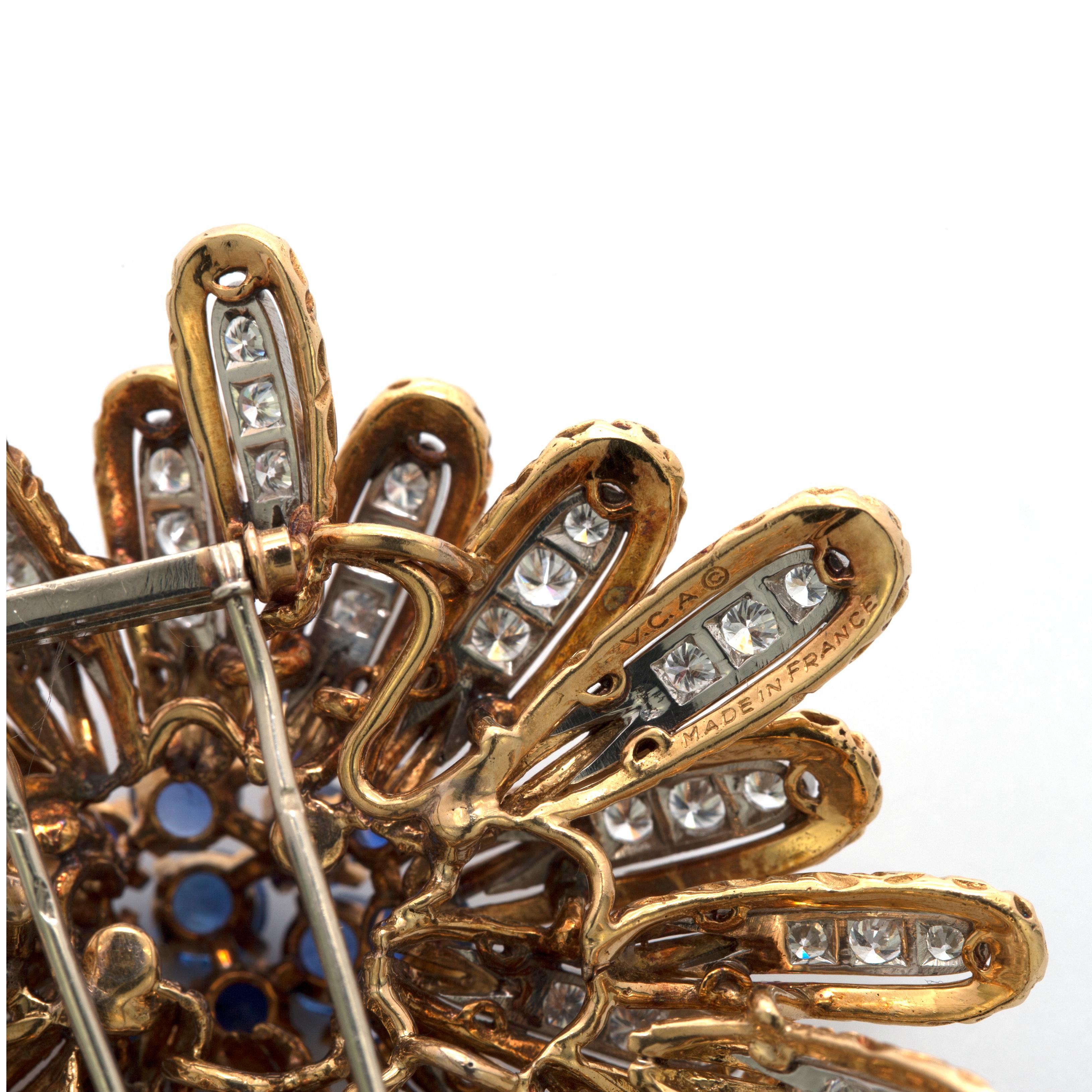 Remarkable craftsmenship. this VCA brooch features 12 round blue sapphires of approximately 1.80 carats and 84 round white diamonds of approximately 7 carats.
stamp: V.C.A
42.41gr
made in france
approx 5cmx5cm
Every Upper-Luxury piece will arrive in