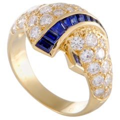 Van Cleef 
Arpels Diamond and Tapered Baguette Sapphire Yellow Gold Ring