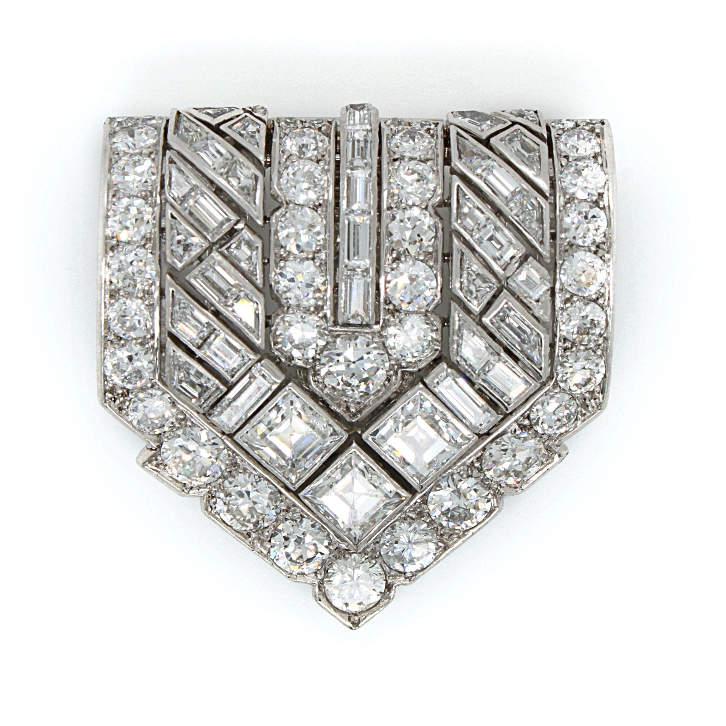 A collective Van Cleef & Arpels diamond Art Deco clip, French, ca. 1920s. 

The clip is set with round brilliant cut and rectangular cut diamonds in a geometric manner, making the clip very wearable for any occasion. The diamonds are of very fine