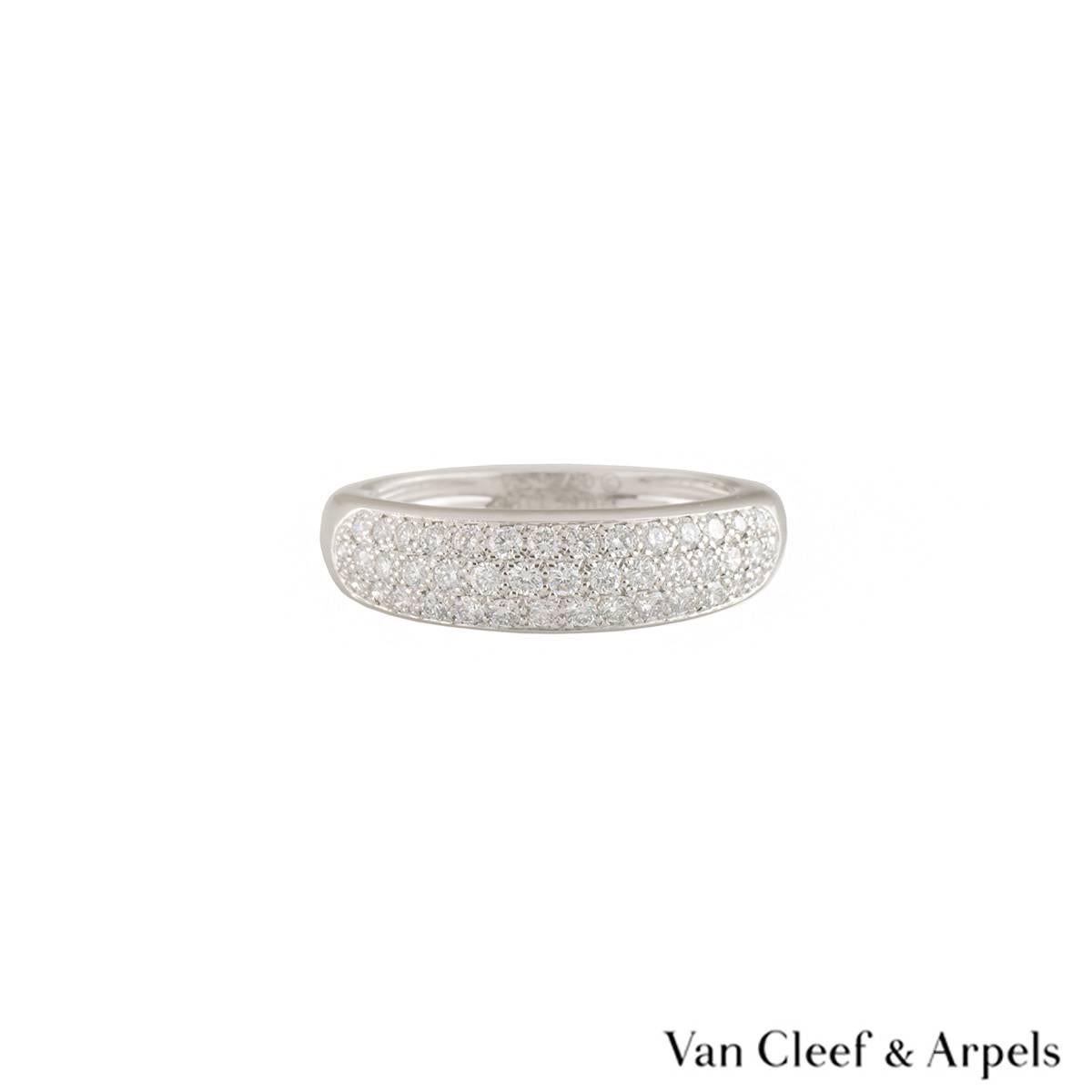A sparkly 18k white gold diamond Van Cleef & Arpels ring. The ring comprises of 3 rows of round brilliant cut diamonds in a pave setting, with a total weight of approximately 0.56ct, predominantly F colour and VS+ clarity. The ring is a size UK I½/