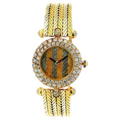 Van Cleef & Arpels Quadrante Chevron con lunetta di diamanti e bracciale in oro bianco e giallo 18 carati