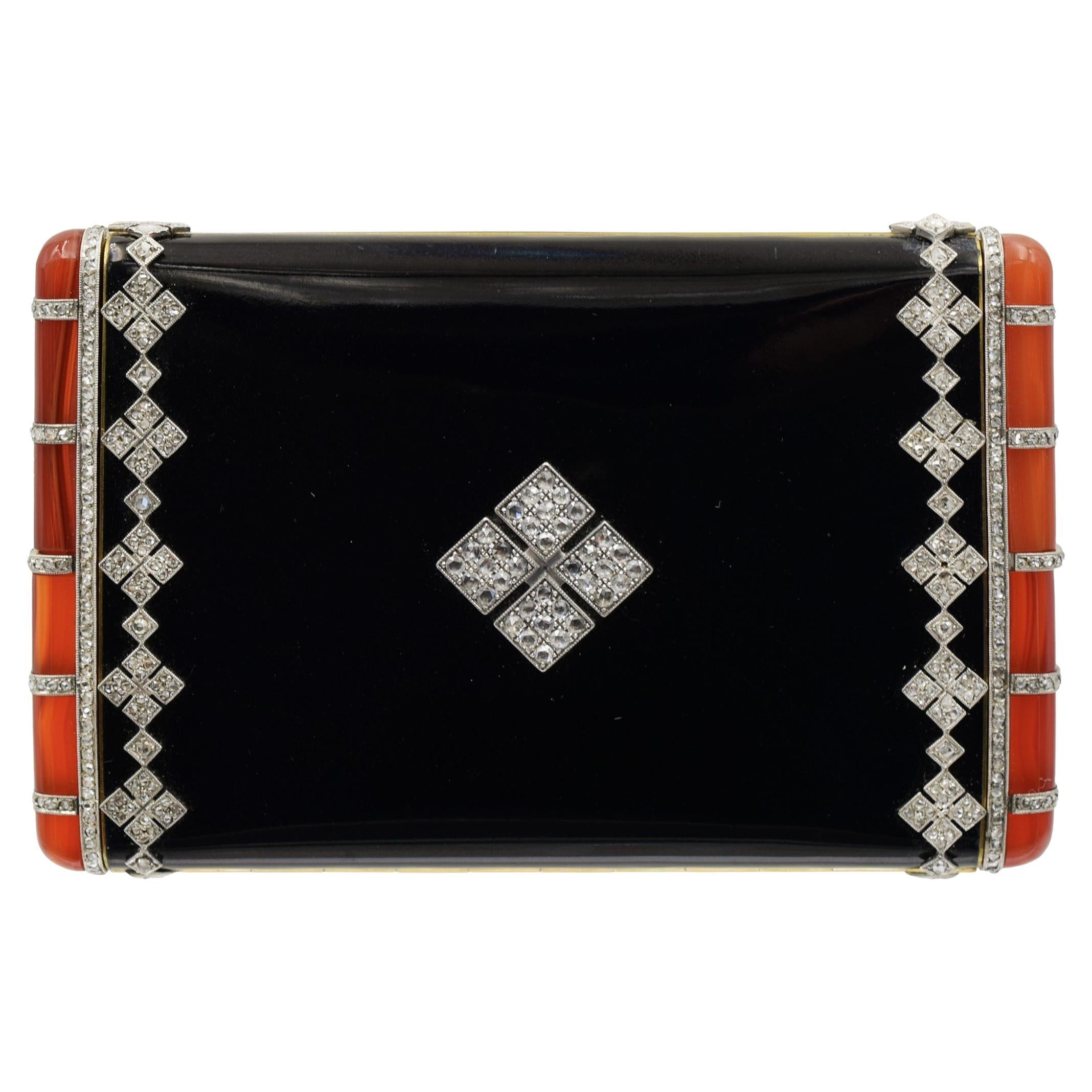 Compatto Van Cleef & Arpels con diamanti, smalto nero e gemme arancioni