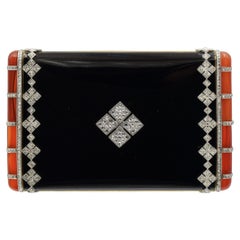 Compatto Van Cleef & Arpels con diamanti, smalto nero e gemme arancioni