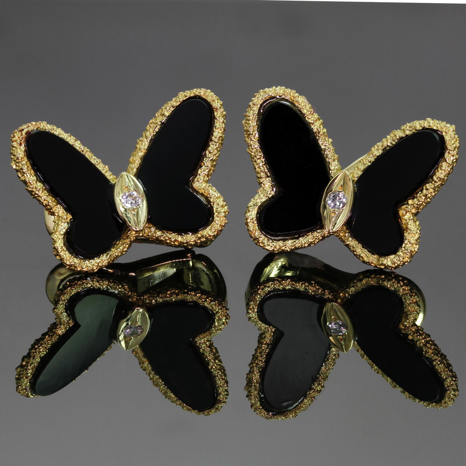 These gorgeous authentic Van Cleef & Arpels lever-back earrings feature the classic butterfly design crafted in 18k yellow gold and set with black onyx petals and  round brilliant D-E-F VVS1-VVS2 diamonds weighing an estimated 0.05 carats. Made in