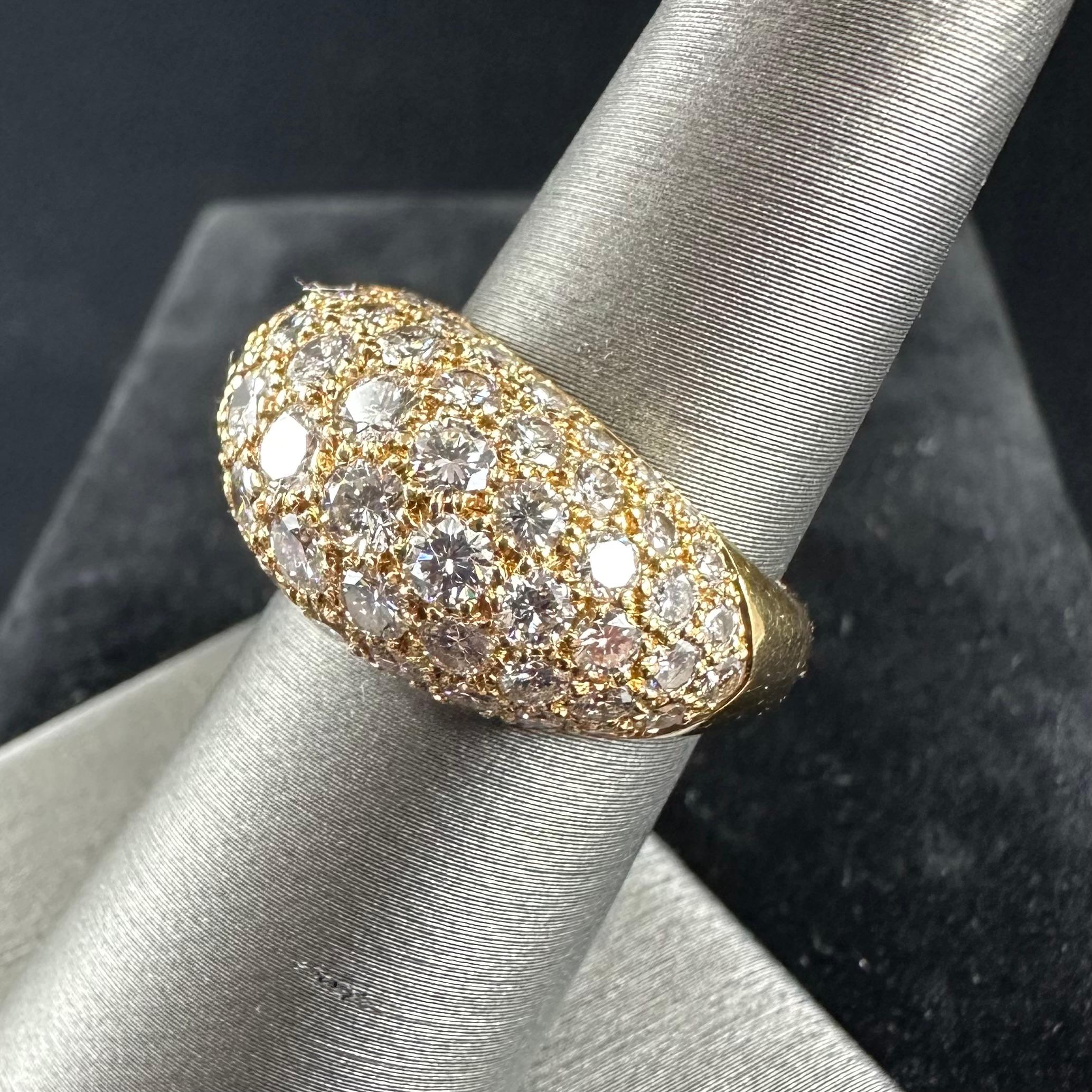 Created circa 1995, this Van Cleef & Arpels NY diamond bombé ring is set in 18K  Yellow gold. The high domed form is pave-set with round brilliant-cut diamonds Estimated 3.15 cts 
Beautifully balanced this sparkling white Diamonds cocktail ring