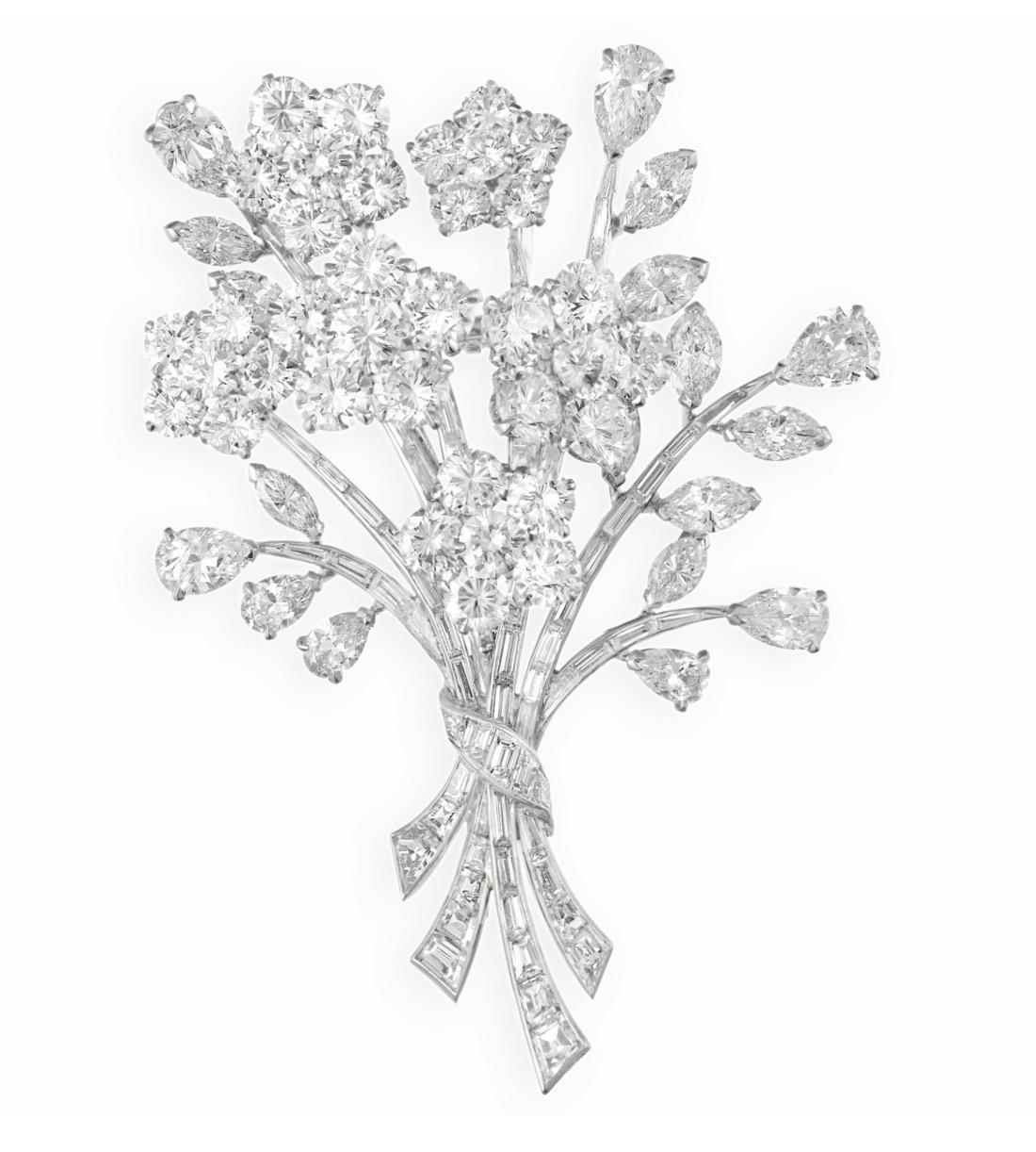 Van Cleef & Arpels Diamond Bouquet Brooch.
This diamond brooch has circular, pear, marquise and baguette-cut diamonds weighing a total of approximately 20carats, diamond are   E/F color and  VS clarity.
Six large flowers have center diamonds ranging