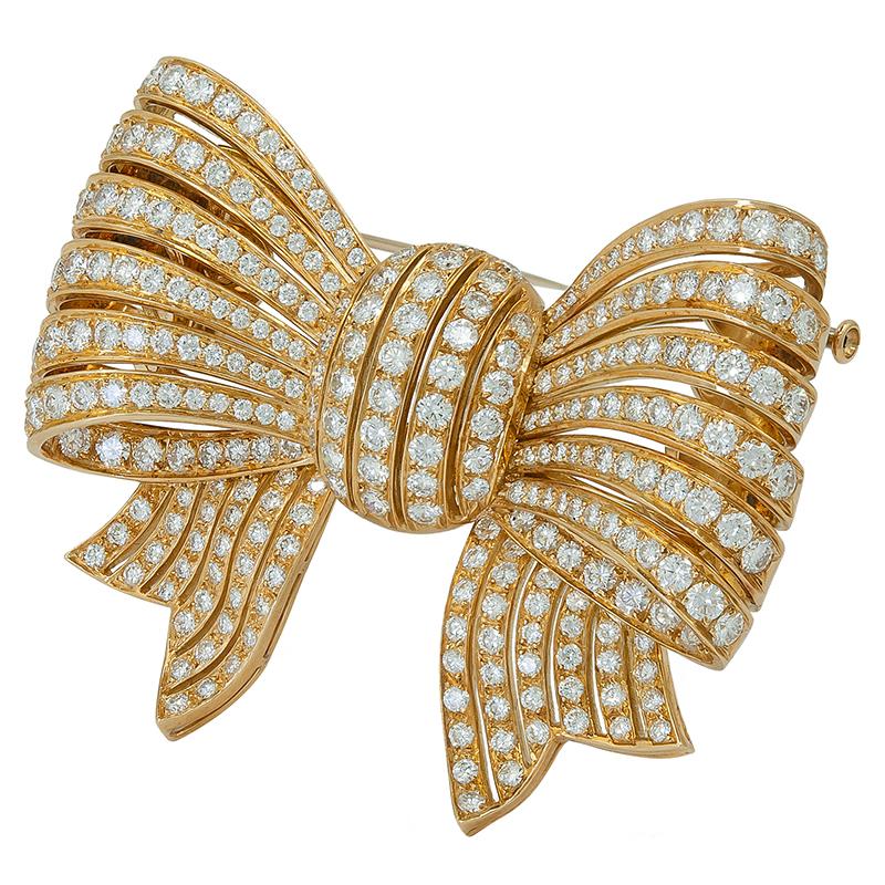 Van Cleef & Arpels Vintage 1980s  Diamond Gold Bow Brooch
An 18k yellow gold bow brooch, set with round brilliant-cut diamonds, signed Van Cleef & Arpels.
Measures approx. 2.25″ in length by 1.75″ in width
Gross weight approx. 40.9 grams
Stamped