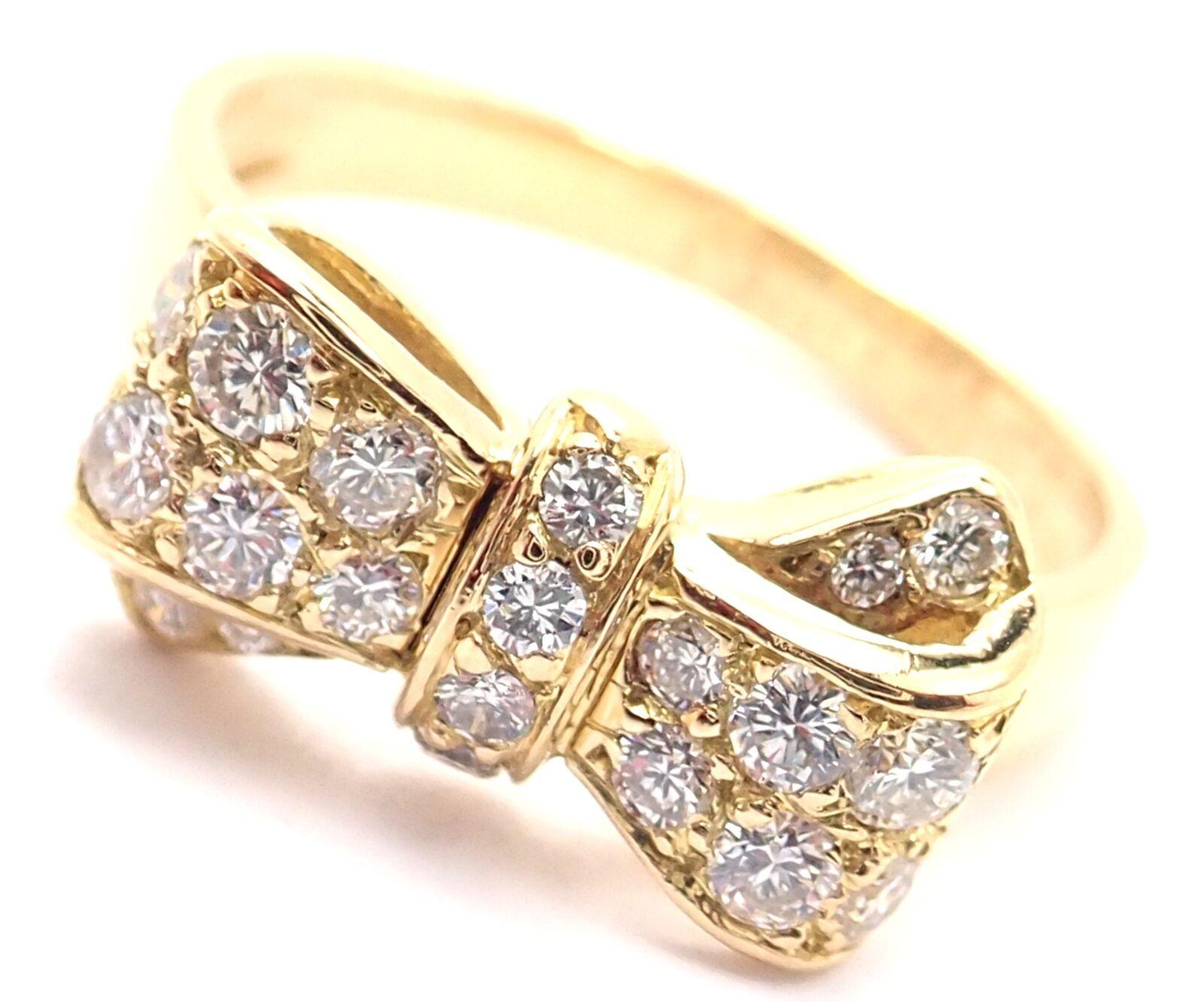 18k Yellow Gold Diamond Bow Motif Band Ring by Van Cleef & Arpels. 
With 20 round brilliant cut diamonds approximately .38ct total weight
VVS1 clarity, E color
Details: 
Weight: 3.7 grams
Ring Size: 5.5
Width: 8mm
Stamped Hallmarks: Van Cleef &