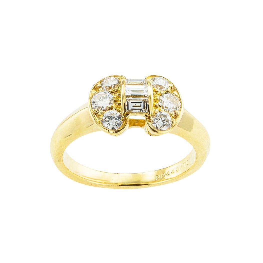 Van Cleef & Arpels diamond bow yellow gold ring circa 1990. *

ABOUT THIS ITEM:  #R-DJ21B. Scroll down for detailed specifications.  A diamond bow motif tops this precious, dainty ring.  It makes an excellent candidate for a promise ring, an