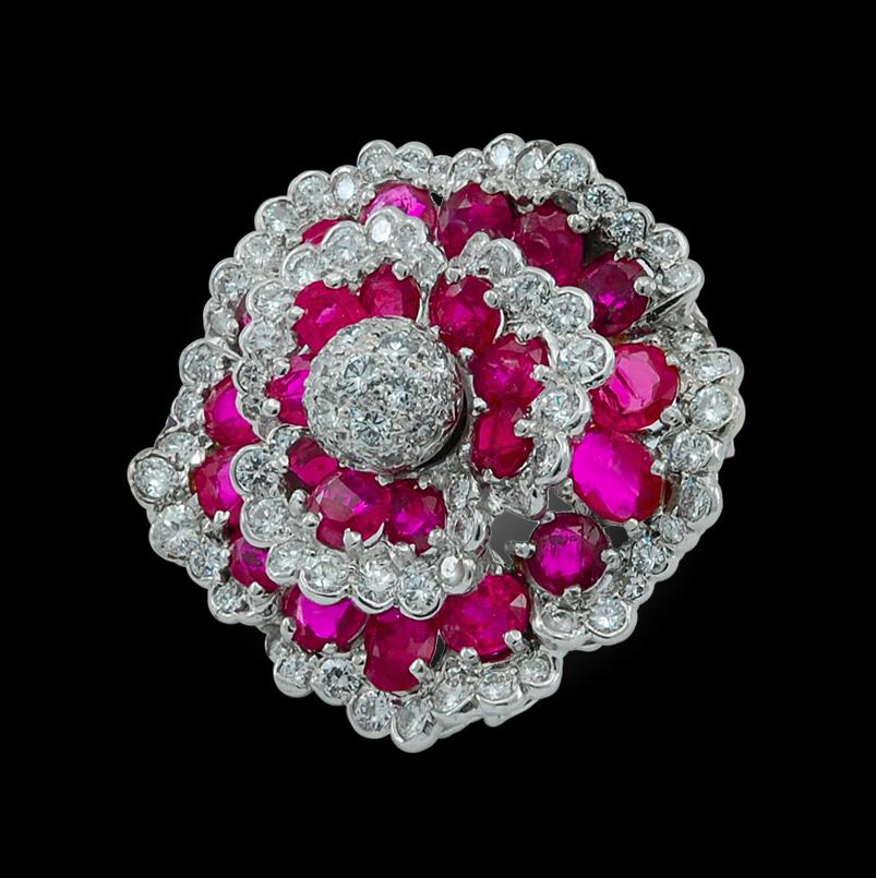 A resplendent Camélia Flower brooch by Van Cleef & Arpels crafted in the 1980’s, comprised as a flower head made of brilliant diamonds and Burma no heat rubies mounted in platinum.

Circa 1980s Gubelin Certificate
Signed Van Cleef & Arpels