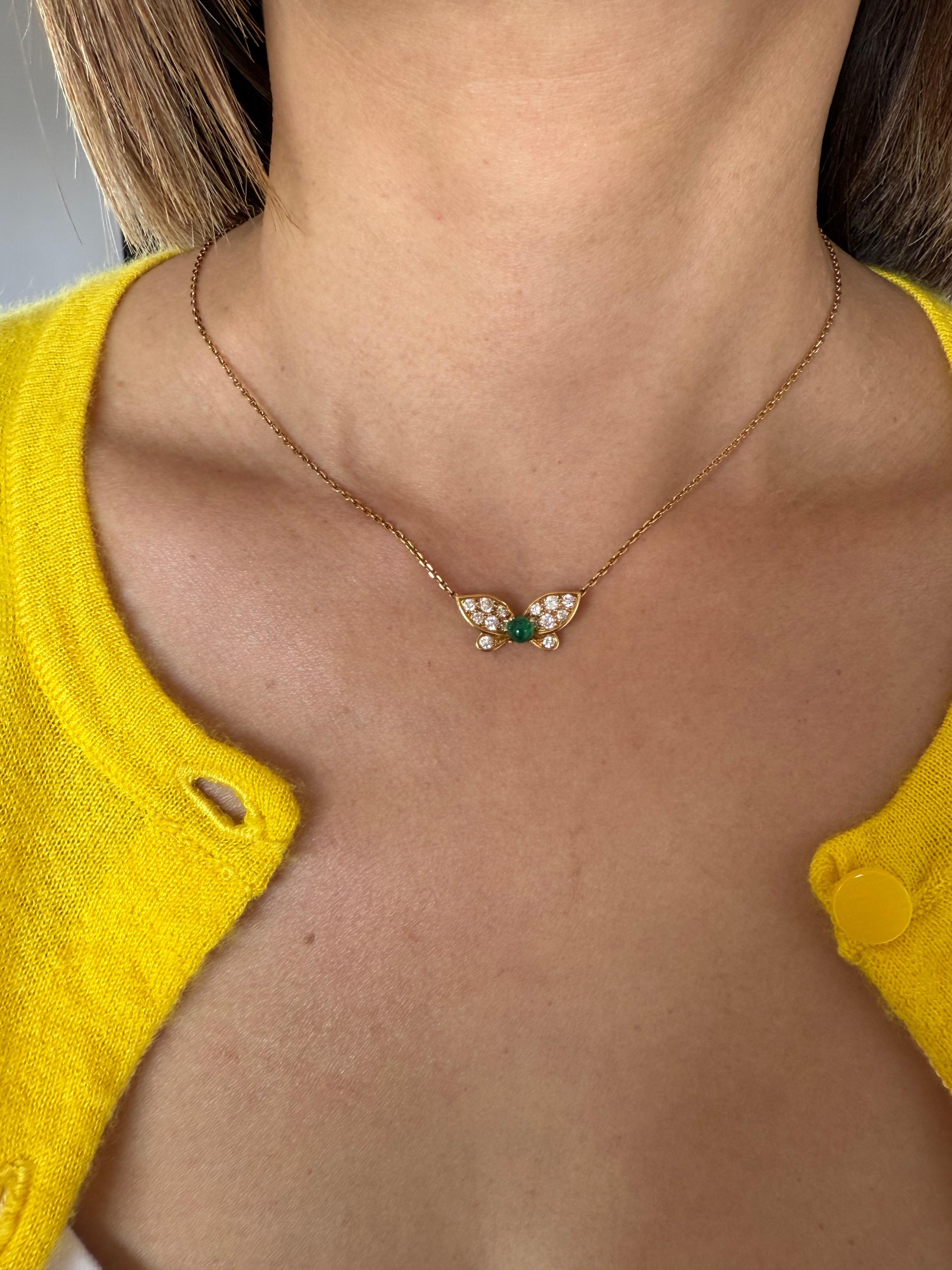 Van Cleef & Arpels 
Green Emerald & Diamonds Butterfly Necklace
 One cabochon Green Emerald est. 0.50 ct and round brilliant-cut D-F VVS1-VVS2 diamonds weighing an estimated 0.50 carats. 
18K Yellow Gold chain has  an adjustable length from 15 to