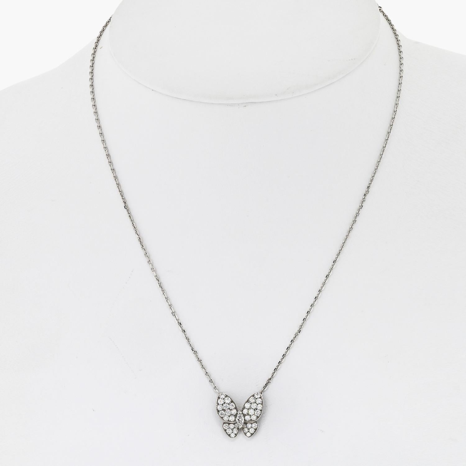 Van Cleef & Arpels Diamond Butterfly Papillon White Gold Necklace. Crafted from luxurious 18k white gold, this exquisite necklace features a captivating diamond butterfly papillon pendant that exudes elegance and sophistication.

Adorned with 35