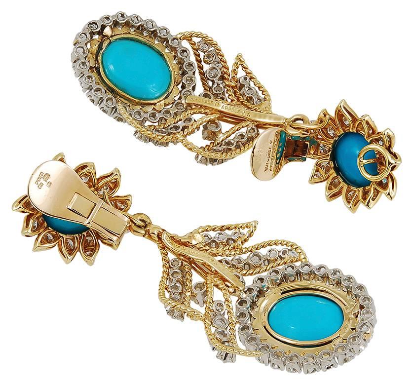 An exquisite set comprising a surmount designed as a flowerhead, each set with a vibrant cabochon turquoise and brilliant-cut diamonds crafted in 18k gold throughout, with clip fittings, combined with a similarly set drop of floral and foliate