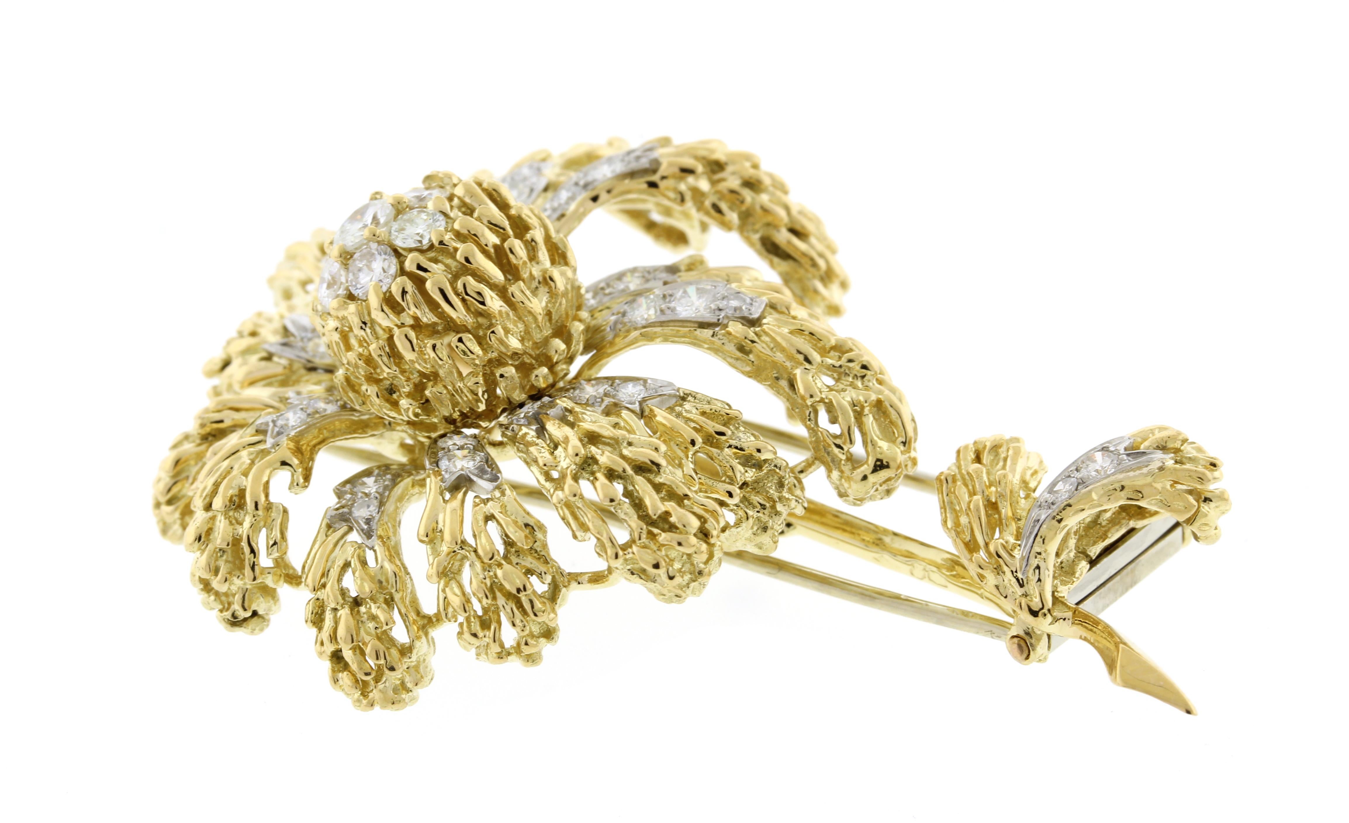 From Van Cleef & Arpel of Paris, a stylish chrysanthemum diamond brooch.  The brooch is expertly design and made in VCA's detective style
• Designer: VCA
• Metal:  18 karat gold
• Circa: 1970s
• Size: 2¼ by ½
• 35 Diamonds weigh 1.50 carats
•