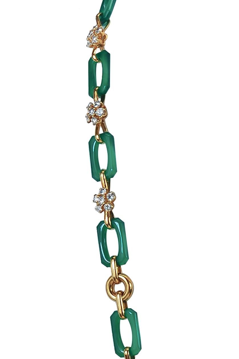 A remarkable Van Cleef & Arpels long 18k gold link necklace that dates back to the 1970's, elegantly set with alternating interlocking links made of 18k gold and chrysoprase. Every other gold link is adorned with round cut diamonds formed to create