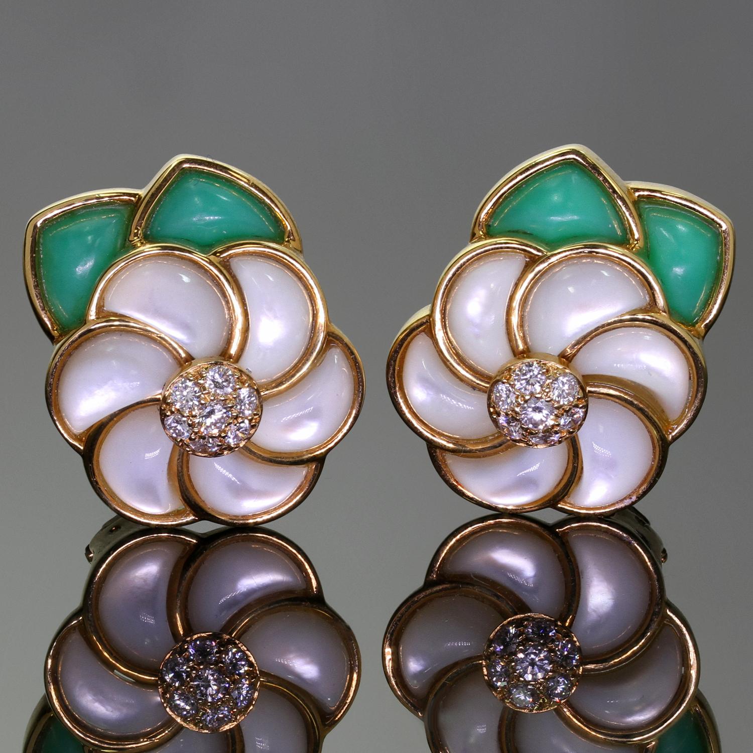 These exquisite Van Cleef & Arpels earrings are feature a flower design crafted in 18k yellow gold, inlaid with green chyrosoprase and mother-of-pearl, and set with brilliant-cut round D-E-F VVS1-VVS2 diamonds weighing an estimated 0.52 carats.