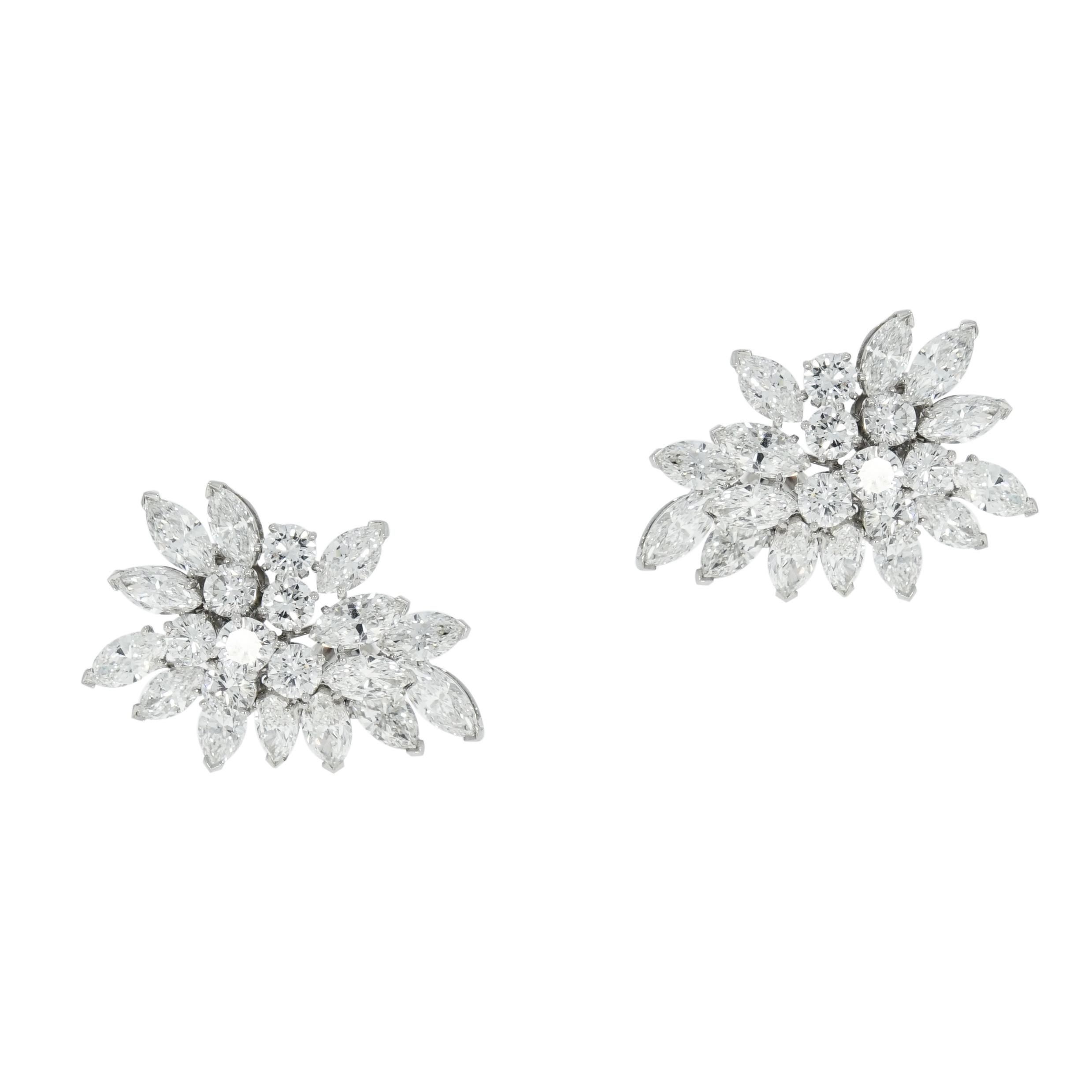 Van Cleef & Arpels has long established itself in the world of designer jewelry.
And this Classic pair of Diamond cluster earrings is just perfect to showcase the beauty of the Diamonds. 
Comprised of 28 marquise shaped and 14 round cut diamonds,