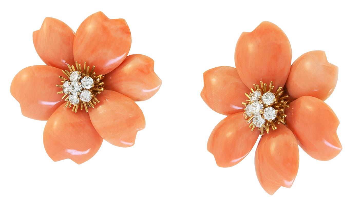 VAN CLEEF & ARPELS Diamond, Coral Flower Earrings
A pair of 18k yellow gold rose de noel flower ear clips, set with orange coral and brilliant-cut round diamonds signed by Van Cleef & Arpels.
Measures approx. 1.40″ in length by 1.46″ in