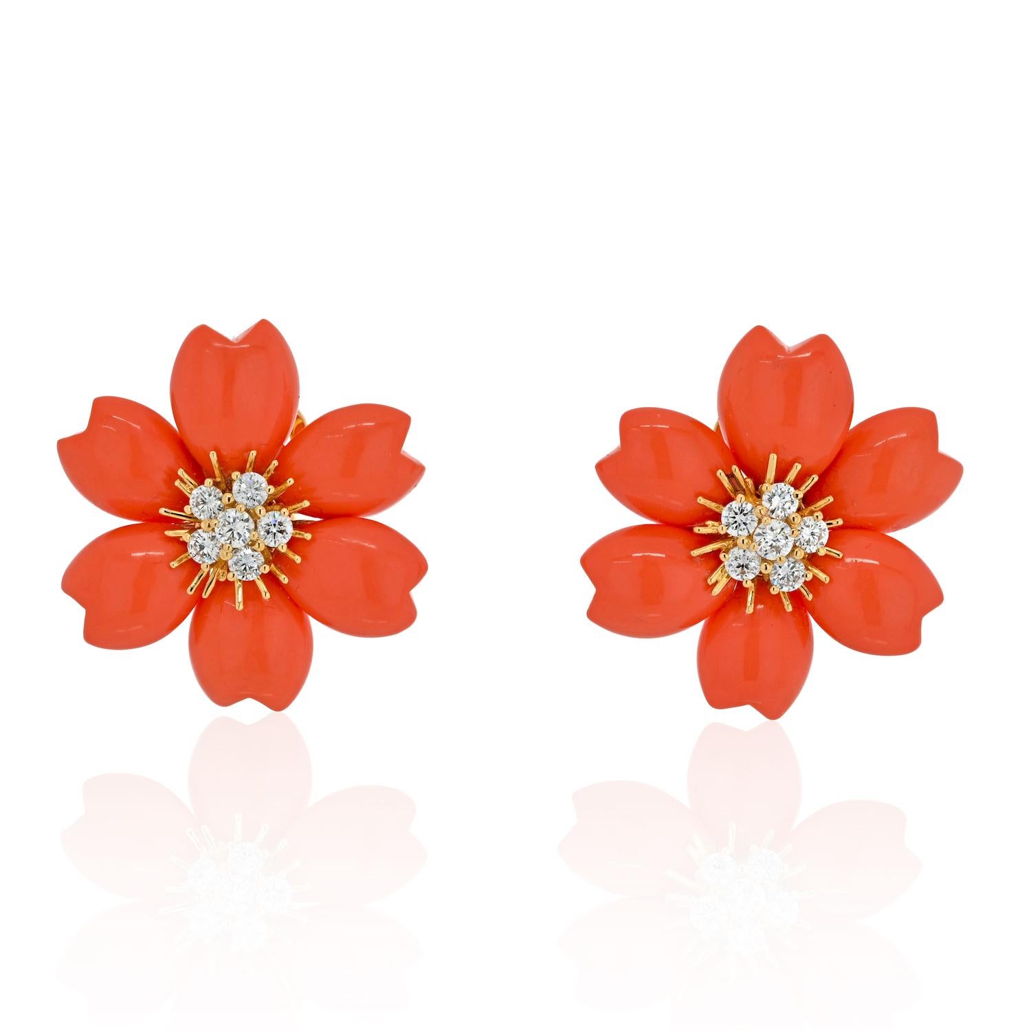 Van Cleef & Arpels Rose de Noël Coral Earrings Small in 18k Yellow Gold.

The recognizable ‘Christmas Rose’, or ‘Rose de Noël’ by Van Cleef & Arpels fashioned in a rare red coral, with a clustered diamond pistil embedded in a gold sunburst, with a