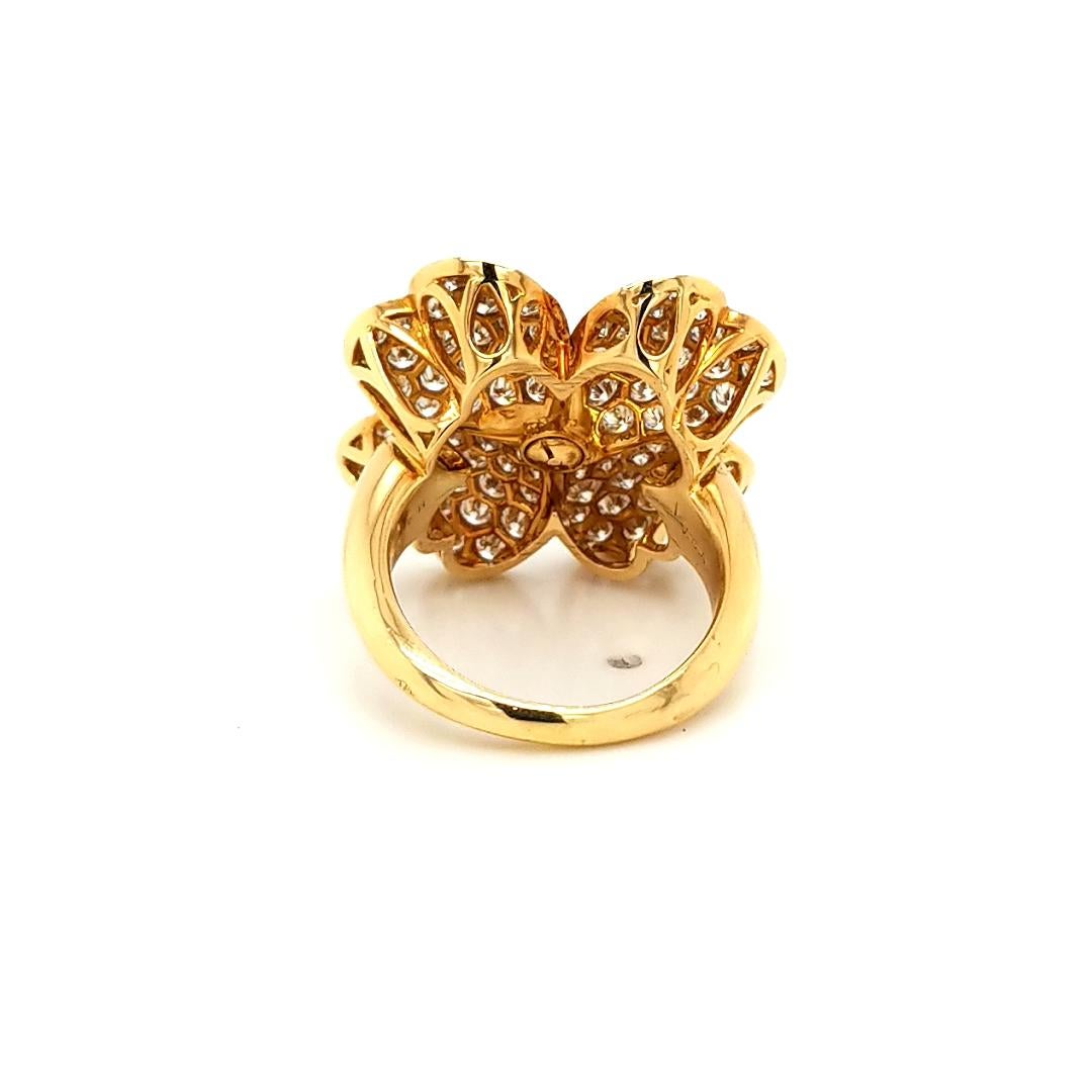 Exclusive VCA Cosmos Diamond Ring made in 18K yellow gold.
Composed of four heart-shaped petals, Cosmos™ is inspired by one of Van Cleef & Arpels' signature flowers set with a 0.36ct round diamond center. 
Serial number will be provided upon