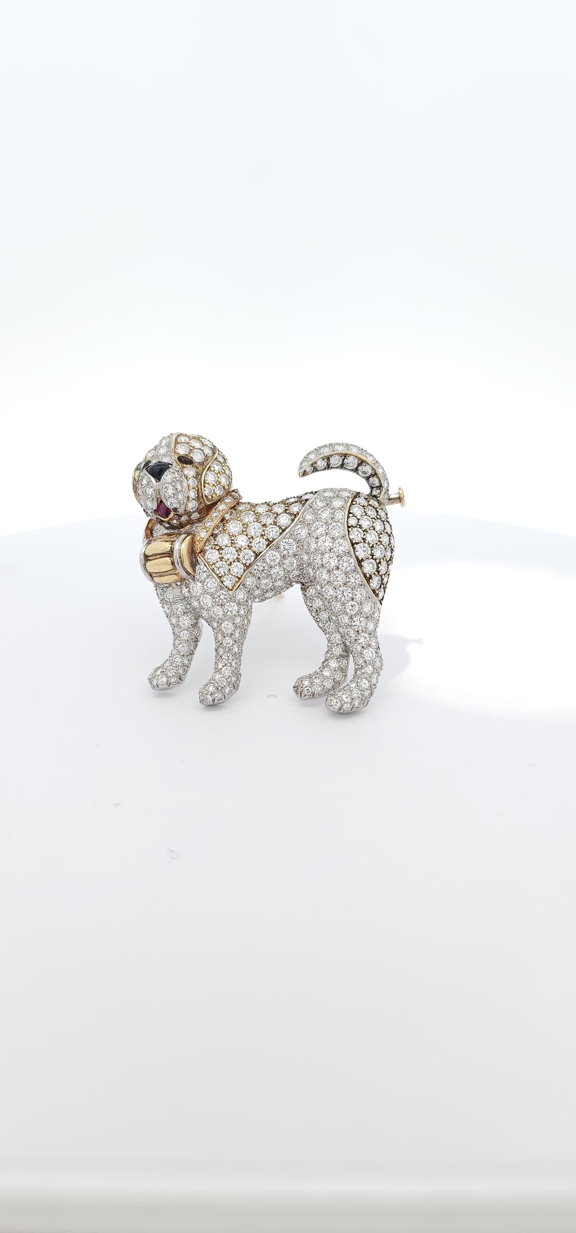 Van Cleef & Arpels Diamond Dog Brooch. 

A Saint Bernard dog brooch featuring pave diamonds, a ruby as the tongue & black enamel nose & eyes.

Diamond Weight: approximately 8.15 carats

Measurements: 1.5 inches long 

Signed, VCA and numbered
Made