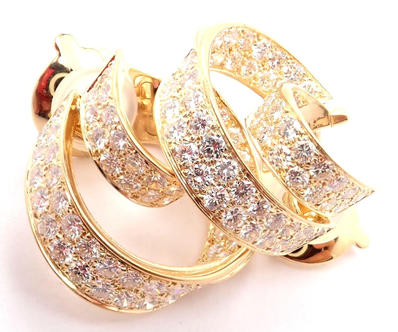18k Yellow Gold Diamond Double Hoop Earrings by Van Cleef & Arpels. 
With 84 round brilliant cut diamond VVS1 clarity, E color total weight 3.84ct
These earrings are for non pierced ears, but they can be converted to pierced by adding