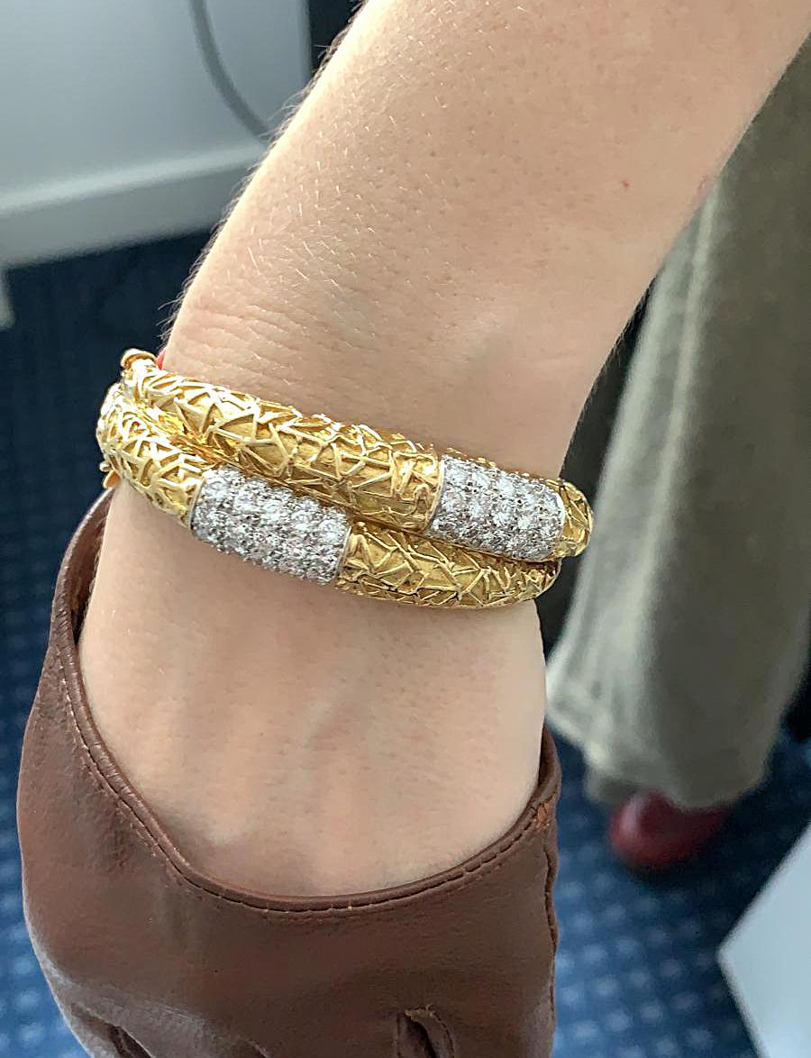 Van Cleef & Arpels Diamond Yellow Gold Double Row Bracelet.

An exceptionally stylish double row bangle bracelet by Van Cleef & Arpels, comprised of textured 18k yellow gold with round brilliant-cut diamond accents.