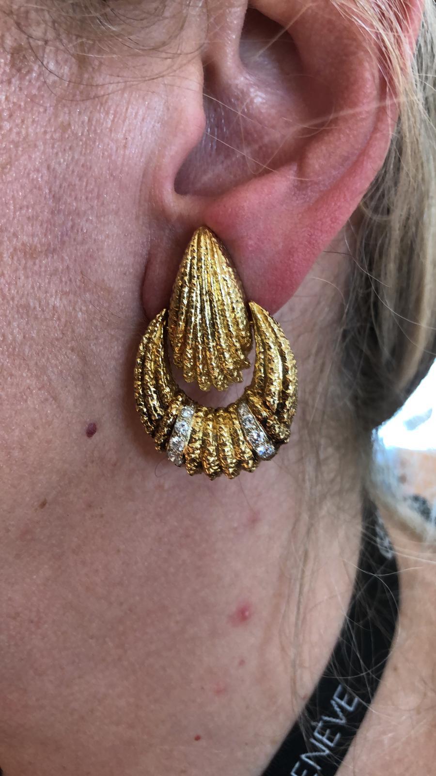 Van Cleef & Arpels Vintage 1970s Hammered Gold Diamond Door Knocker Earrings
Intricately crafted Van Cleef & Arpels earrings, comprised of textured 18k yellow gold with brilliant diamond accents, Signed Van Cleef & Arpels, vintage and estate