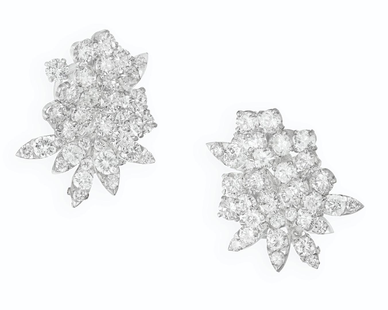 Van Cleef & Arpels Diamond Flower Earrings.
 This pair of earrings has circular- cut diamonds weight approximately 9-10ct all set in 18k white gold.
 Signed:  Van Cleef & Arpels & numbered xxxxxx
Maker's mark and French Hallmark
 Measurements: 1.00