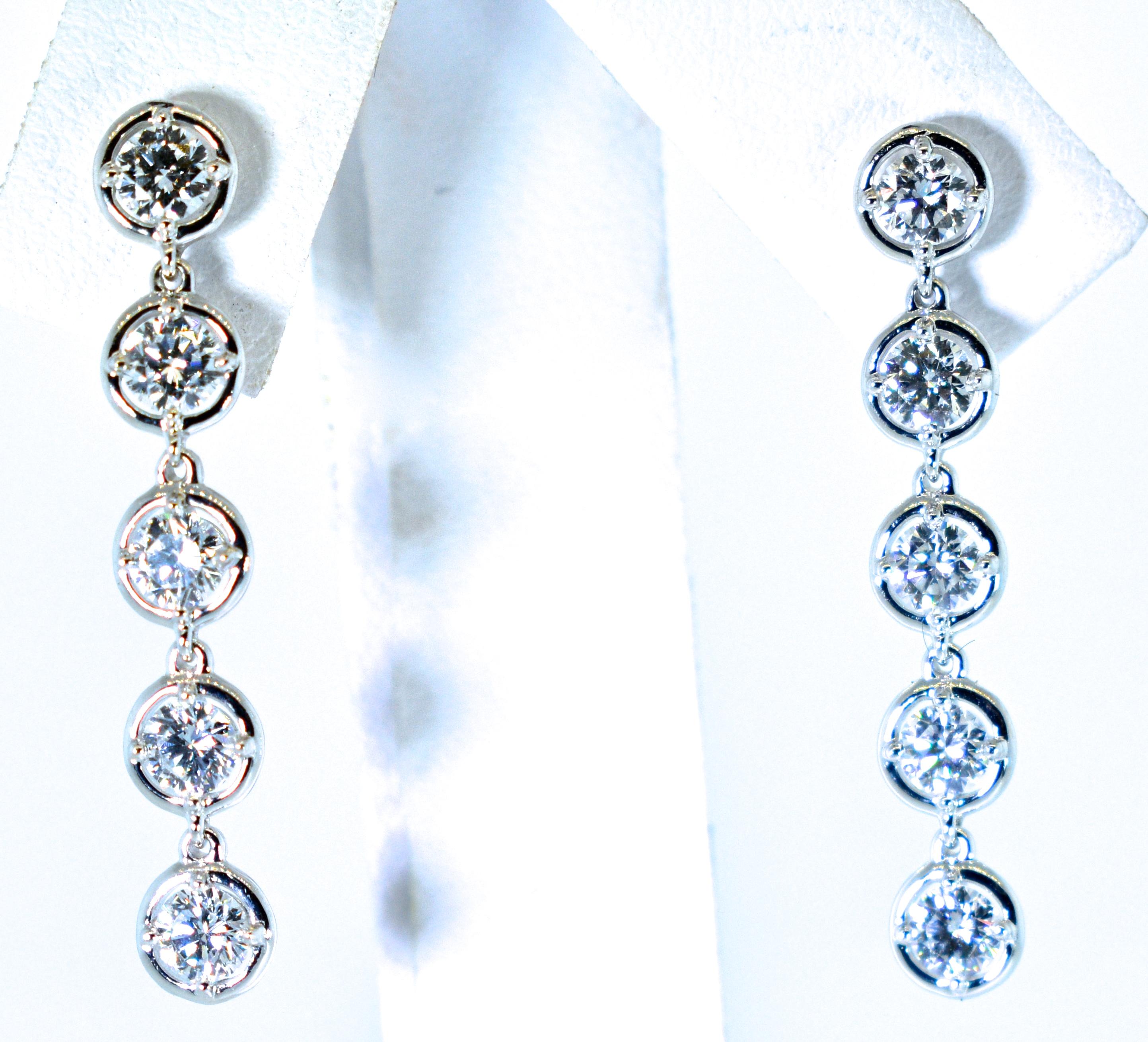 Van Cleef & Arpels diamond drop earrings with 10 diamonds all well cut and well matched, approximately colorless (F), and very very slightly included (VVS) quality.  The total diamond is estimated to be 2.2 cts.  These 1.25 inch long well made