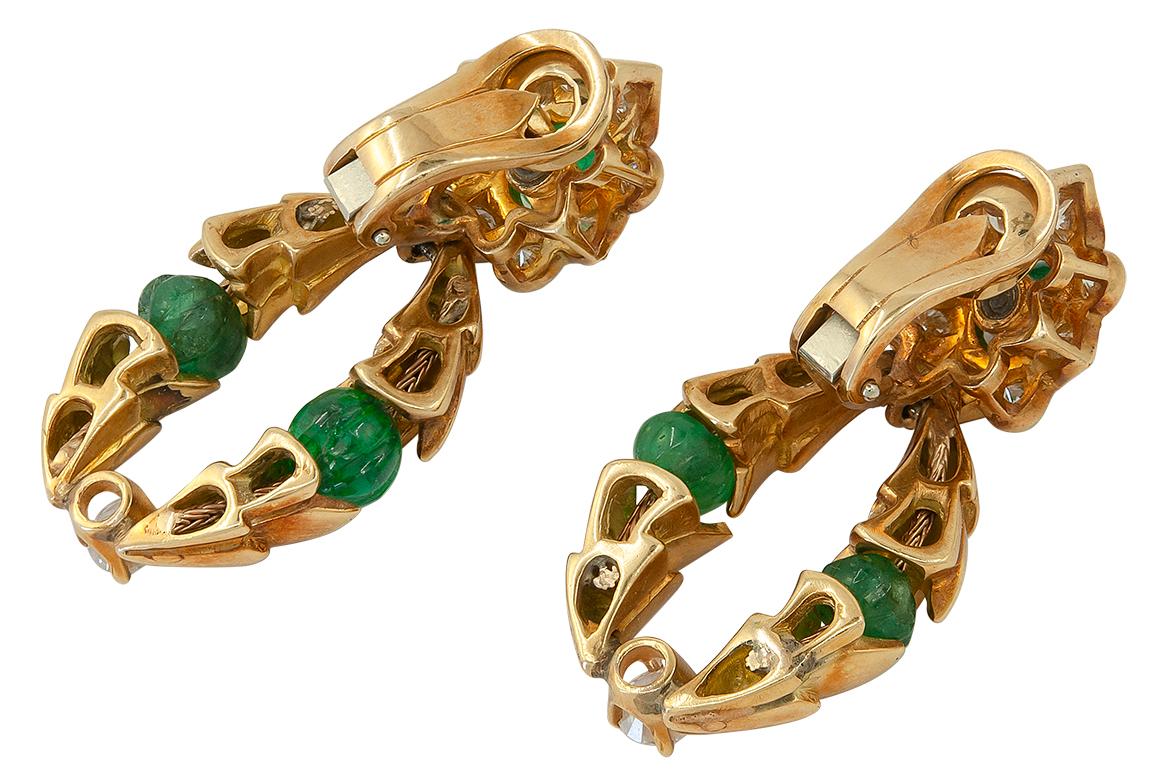 VAN CLEEF & ARPELS Diamond, Emerald Earrings
A pair of 18k rose gold ear clips, set with diamonds and emerald beads signed by Van Cleef & Arpels.
measures 1.25″ in length by 0.50″ width
circa 1970s
