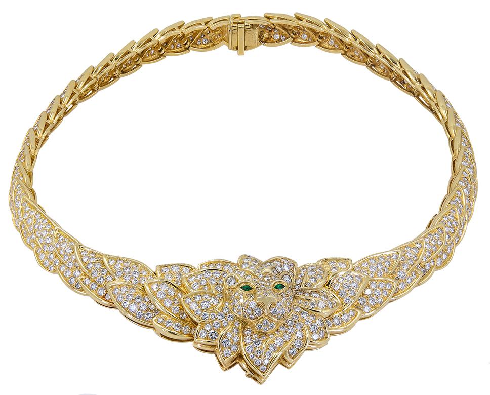 VAN CLEEF & ARPELS Diamond, Emerald Lion Necklace

An 18k yellow gold Lion necklace, set with diamonds, marquise-cut emeralds. The central panel is detachable and may be worn as a brooch.
Measures of necklace approx. 14.5″ in length and brooch 1.5″