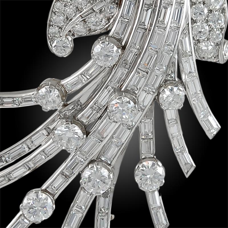Platinum diamond flower pin, signed Van Cleef & Arpels.
total diamond approx. 20 cts.
Circa 1960s
Made in France
